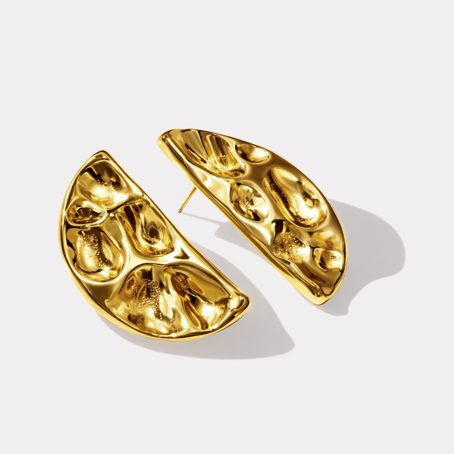 Bizou SF253E009GL – Gold large half-moon hammered stainless steel earrings, bold sculptural design, angled view, Bizou jewelry