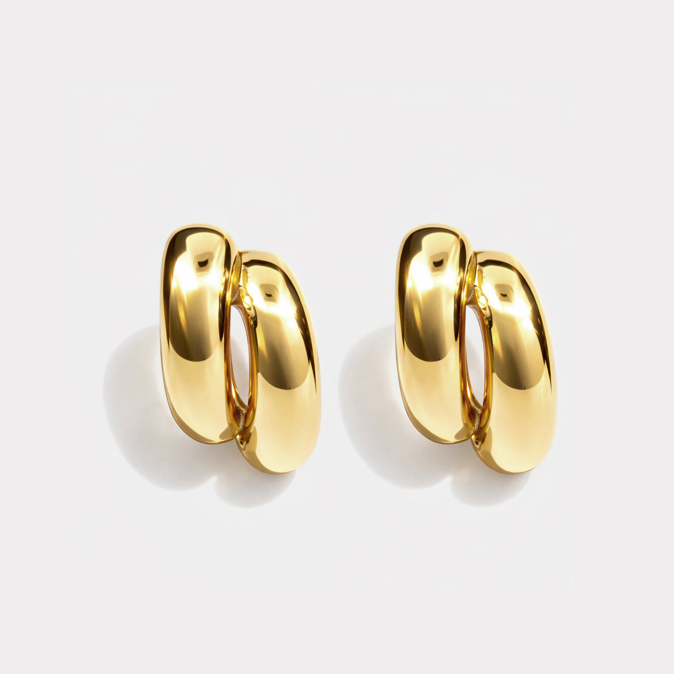 Bizou SF253E012GL – Gold chunky double hoop earrings in stainless steel, bold layered claw design, front view, Bizou jewelry