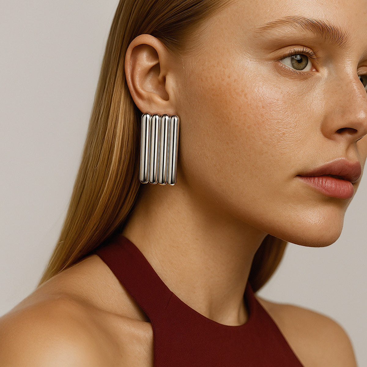 Bizou SF253E013SL – Woman wearing silver oversized multi-bar rectangular stainless steel statement earrings, side profile, Bizou jewelry