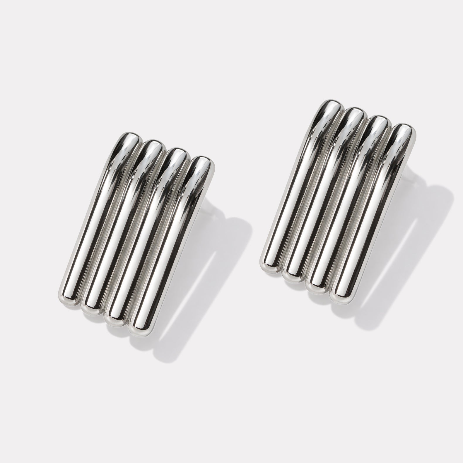 Bizou SF253E013SL – Silver bold sculptural multi-bar stainless steel earrings, high-polish finish, angled view, Bizou jewelry