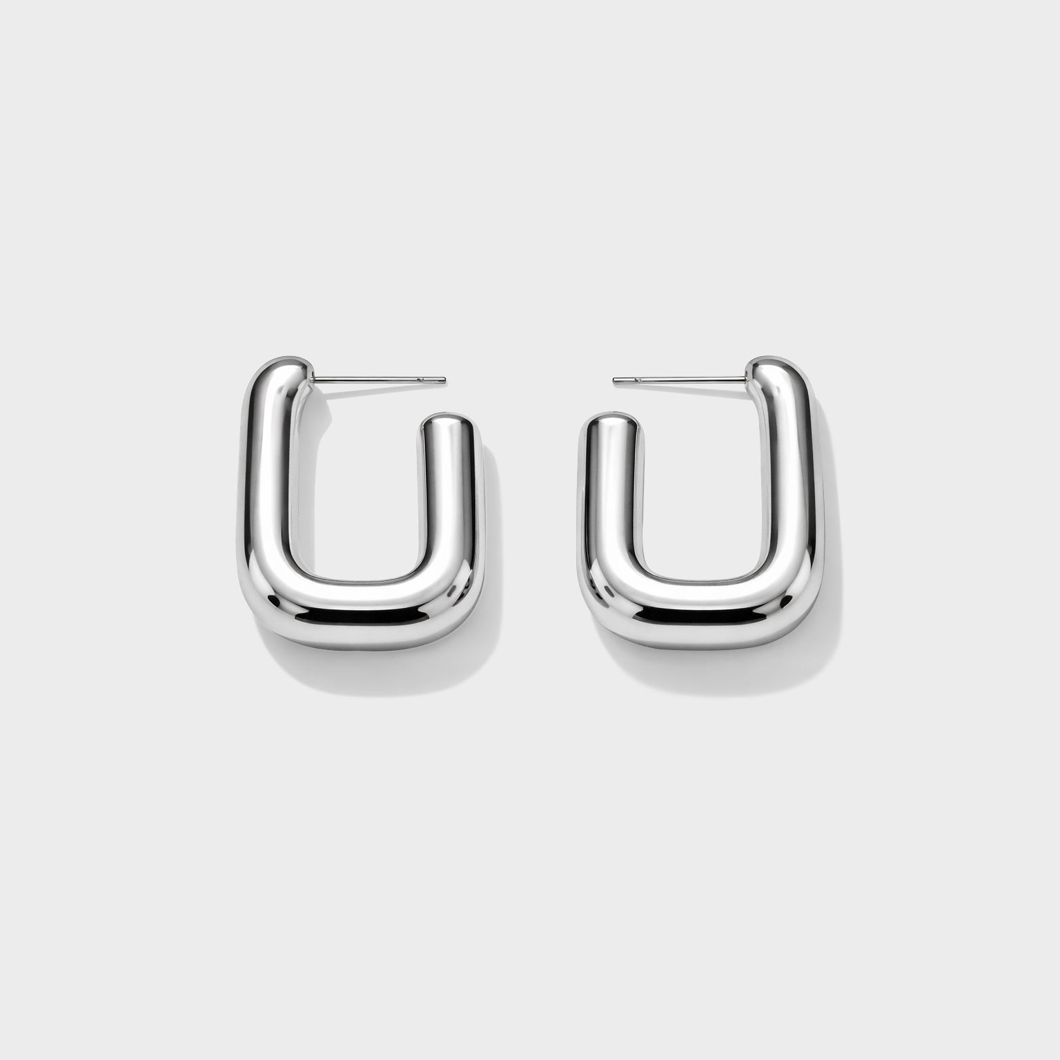 Bizou SF253E015SL – Silver chunky rectangular hoop earrings in stainless steel, bold tubular U-shape design, front view, Bizou jewelry