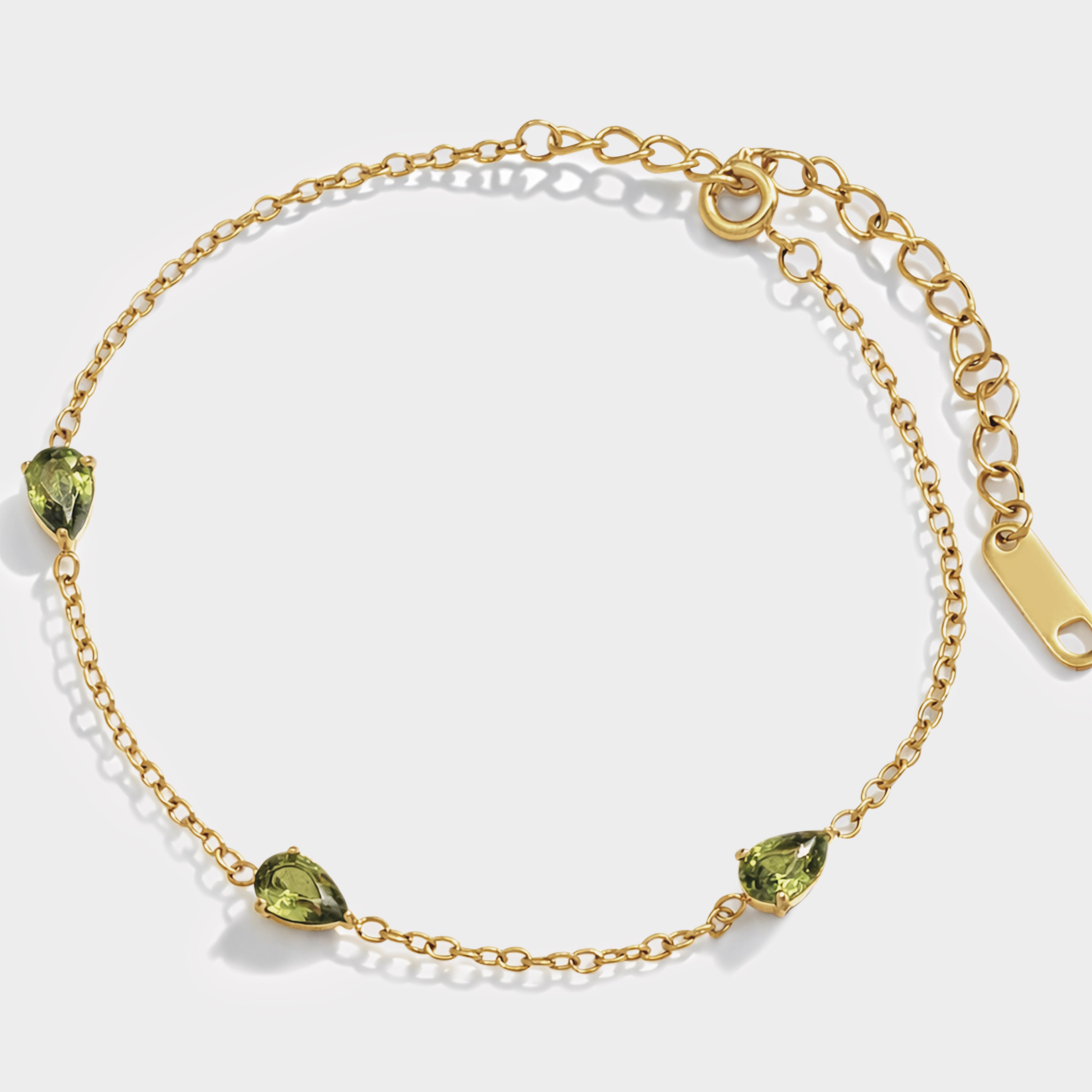Bizou SS253B018GL – Gold station bracelet with three peridot green teardrop crystals in stainless steel, adjustable spring clasp, Bizou jewelry