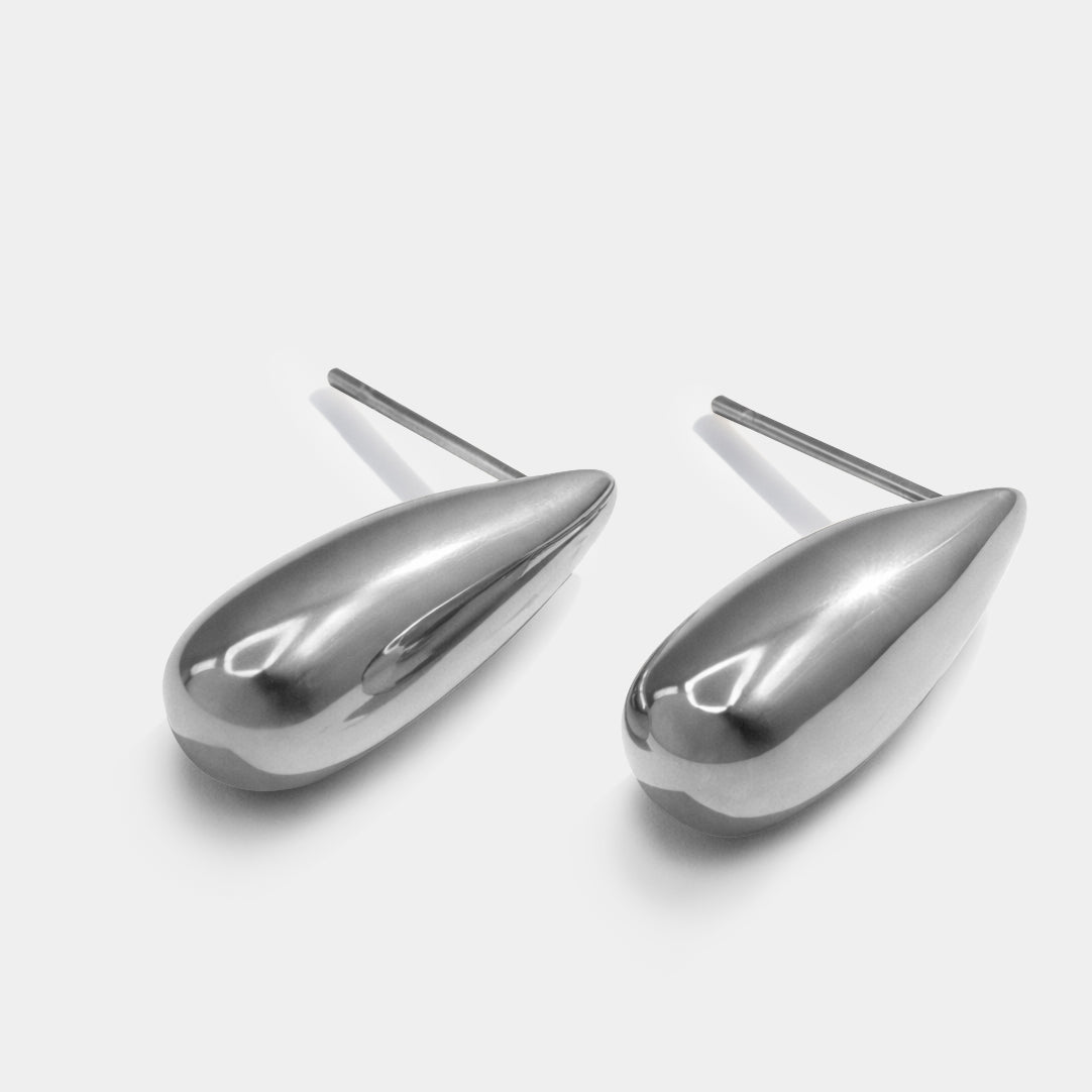 Bizou SS253E001SL – Silver chunky teardrop stud earrings in stainless steel, bold polished sculptural design, angled view, Bizou jewelry