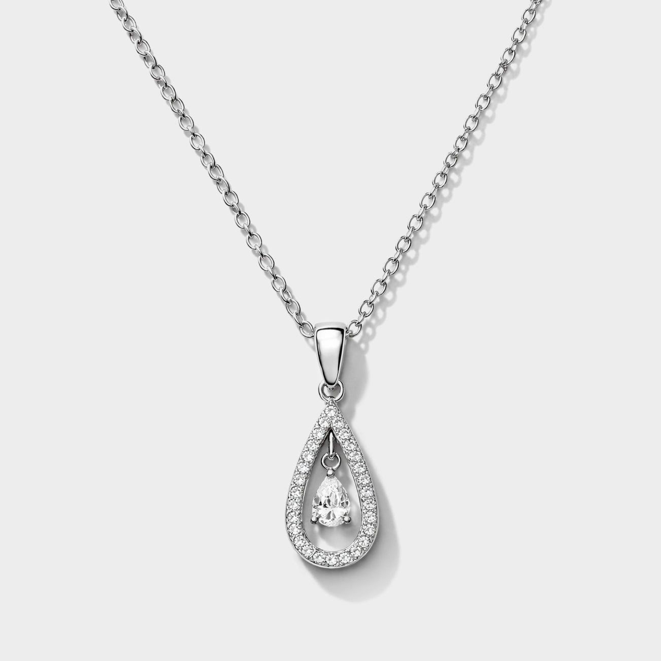 Bizou SS253N018SL – Silver pavé teardrop CZ pendant necklace in stainless steel, open drop frame with floating pear-cut CZ centre stone on chain, front view