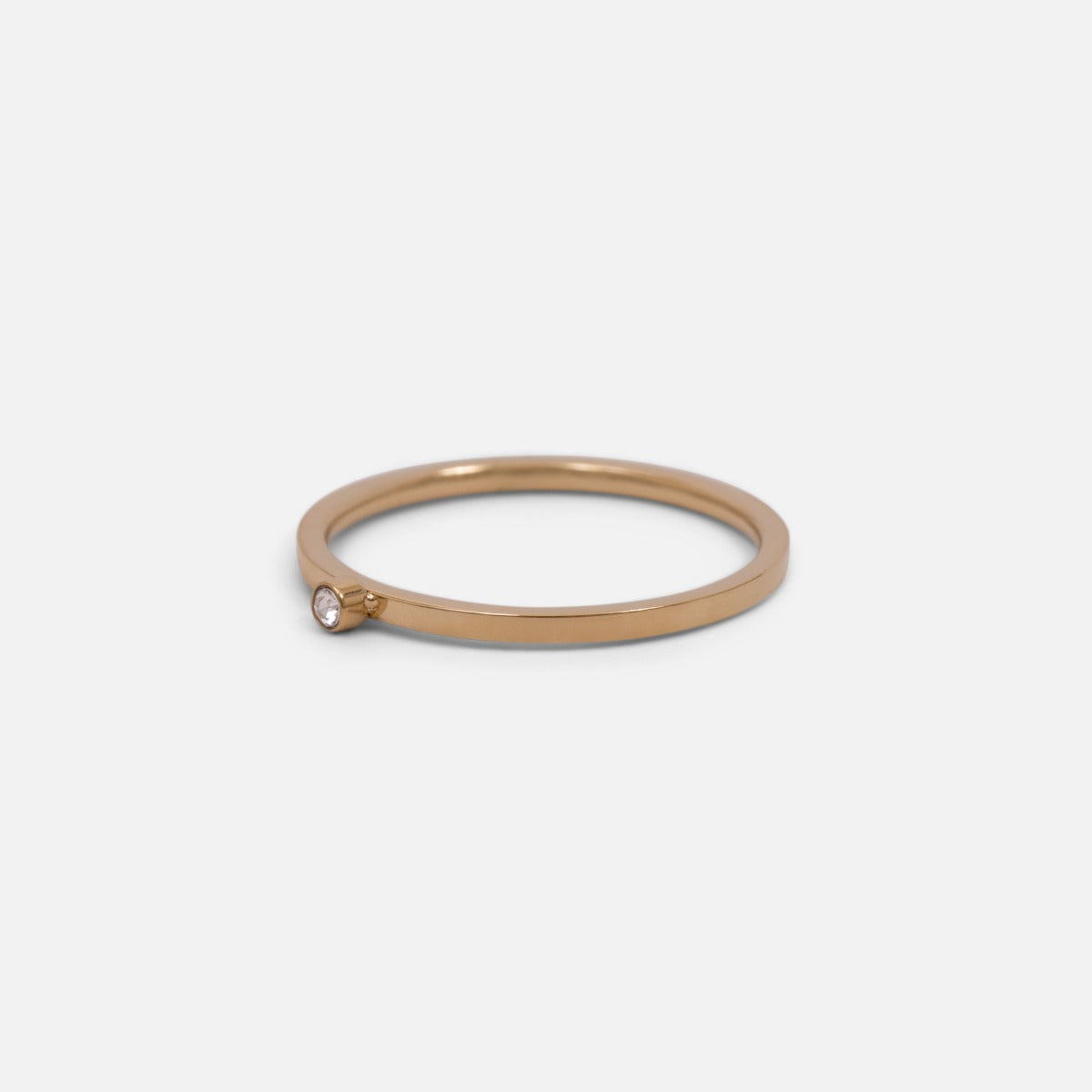 Set of three golden stainless steel wave, twist and zirconium rings