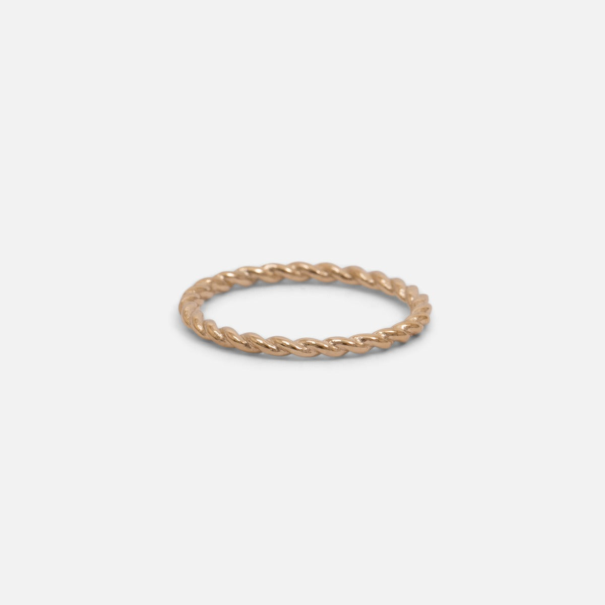 Set of three golden stainless steel wave, twist and zirconium rings