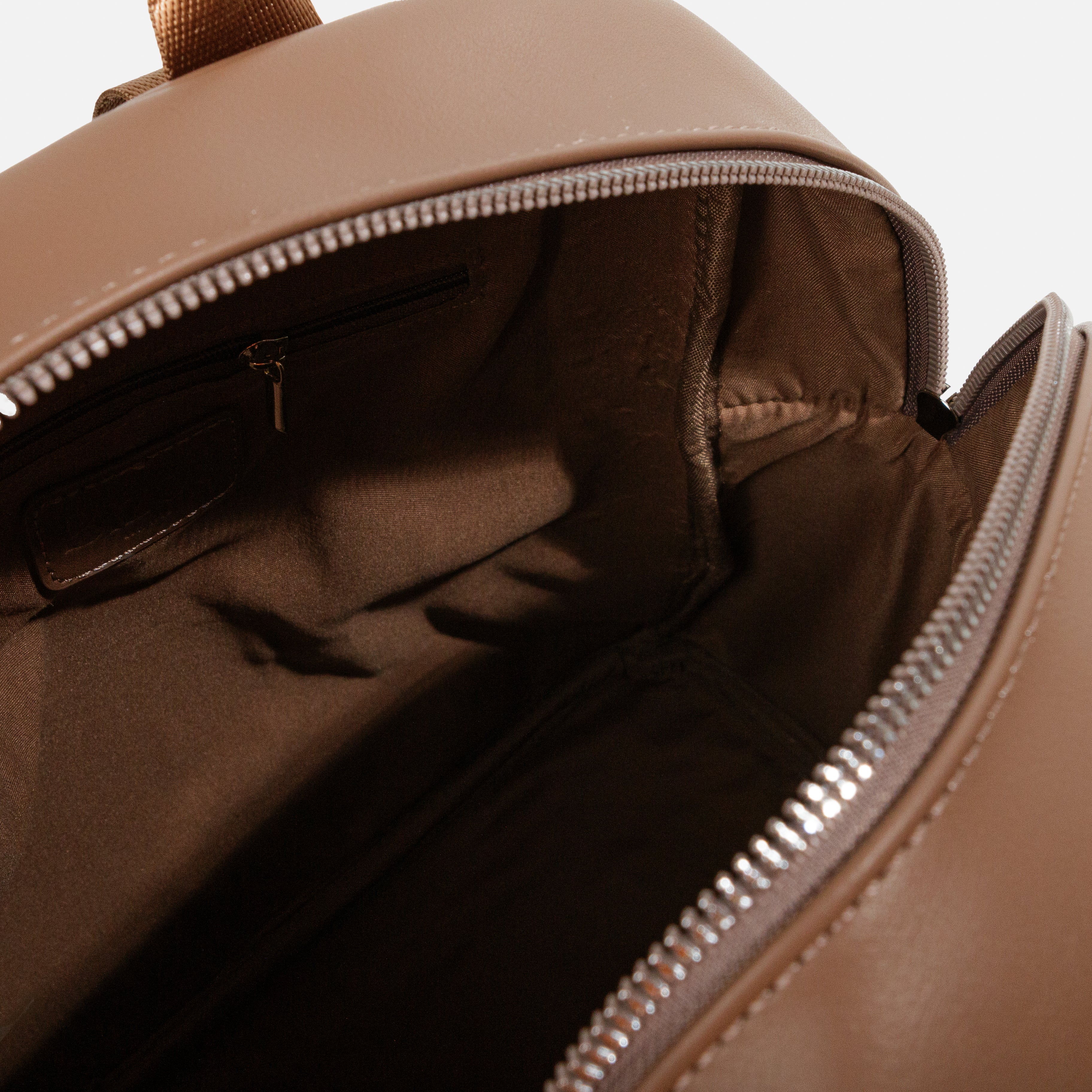 Light brown backpack with nylon straps