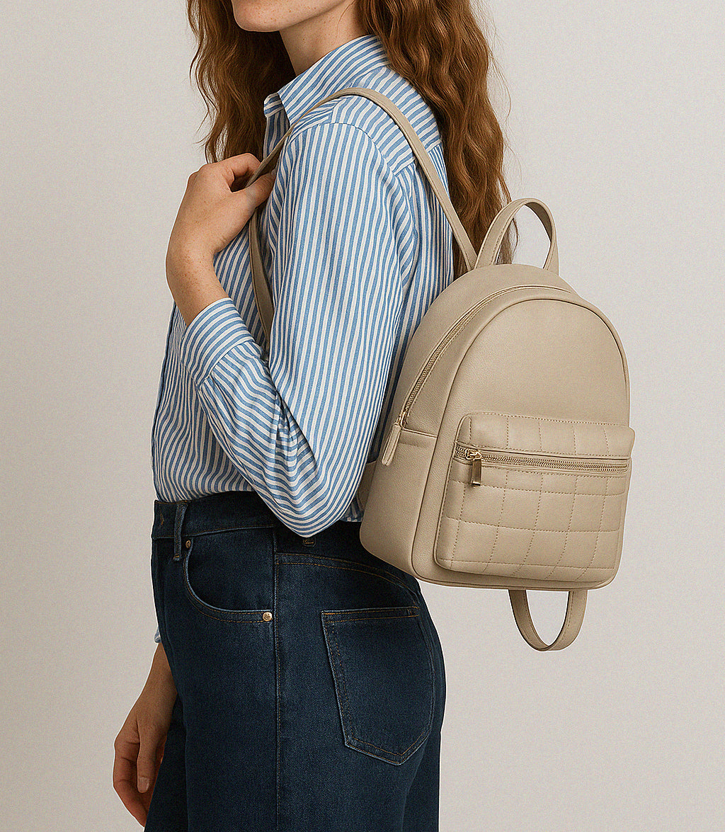 Beige smooth PU backpack with quilted front pocket