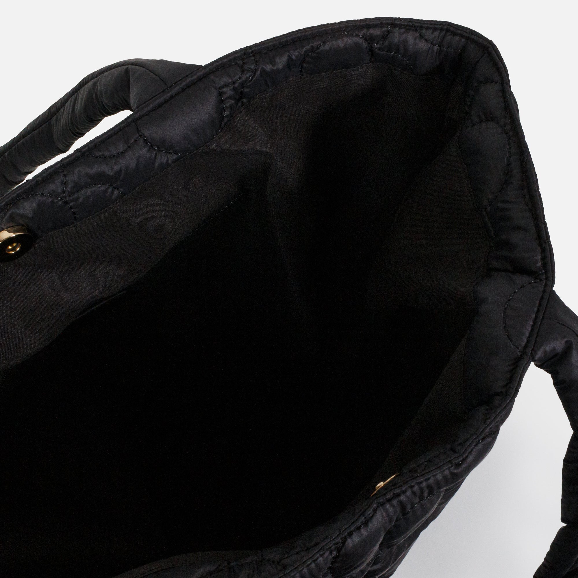 Black quilted nylon tote bag with embroidered flowers