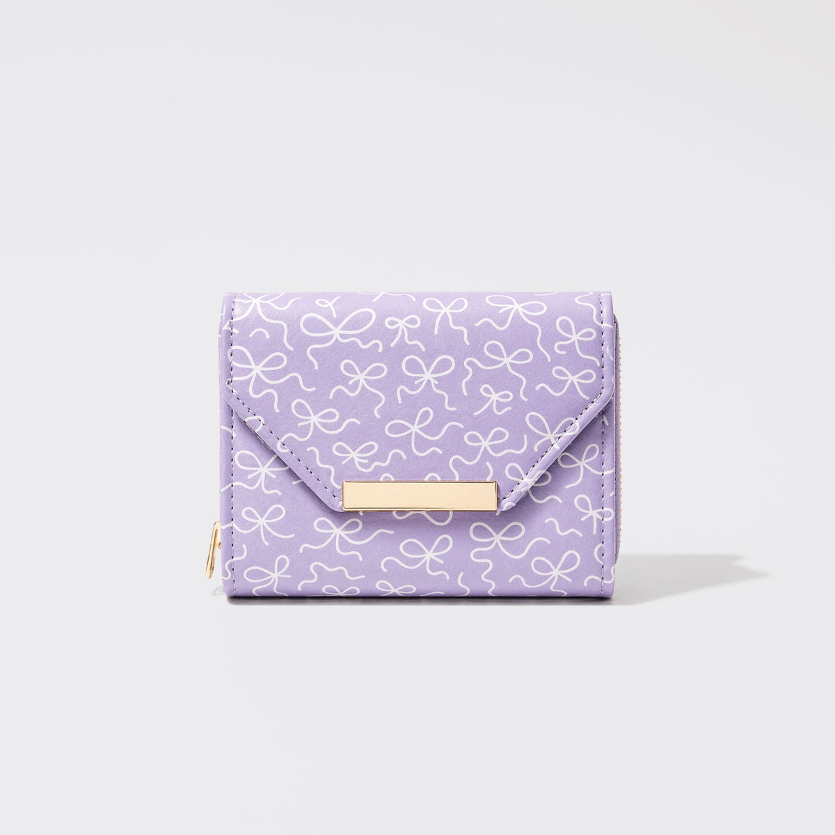 Petit portefeuille lilas à motif nœuds et barrette dorée