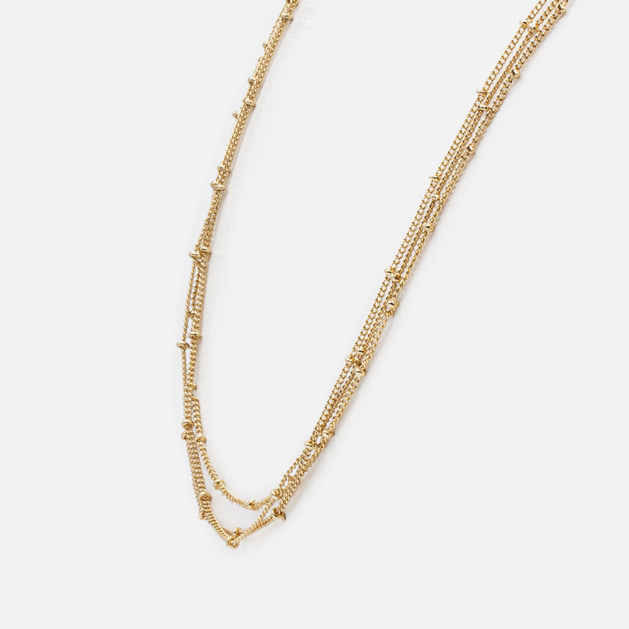 Triple gold chain with small discs