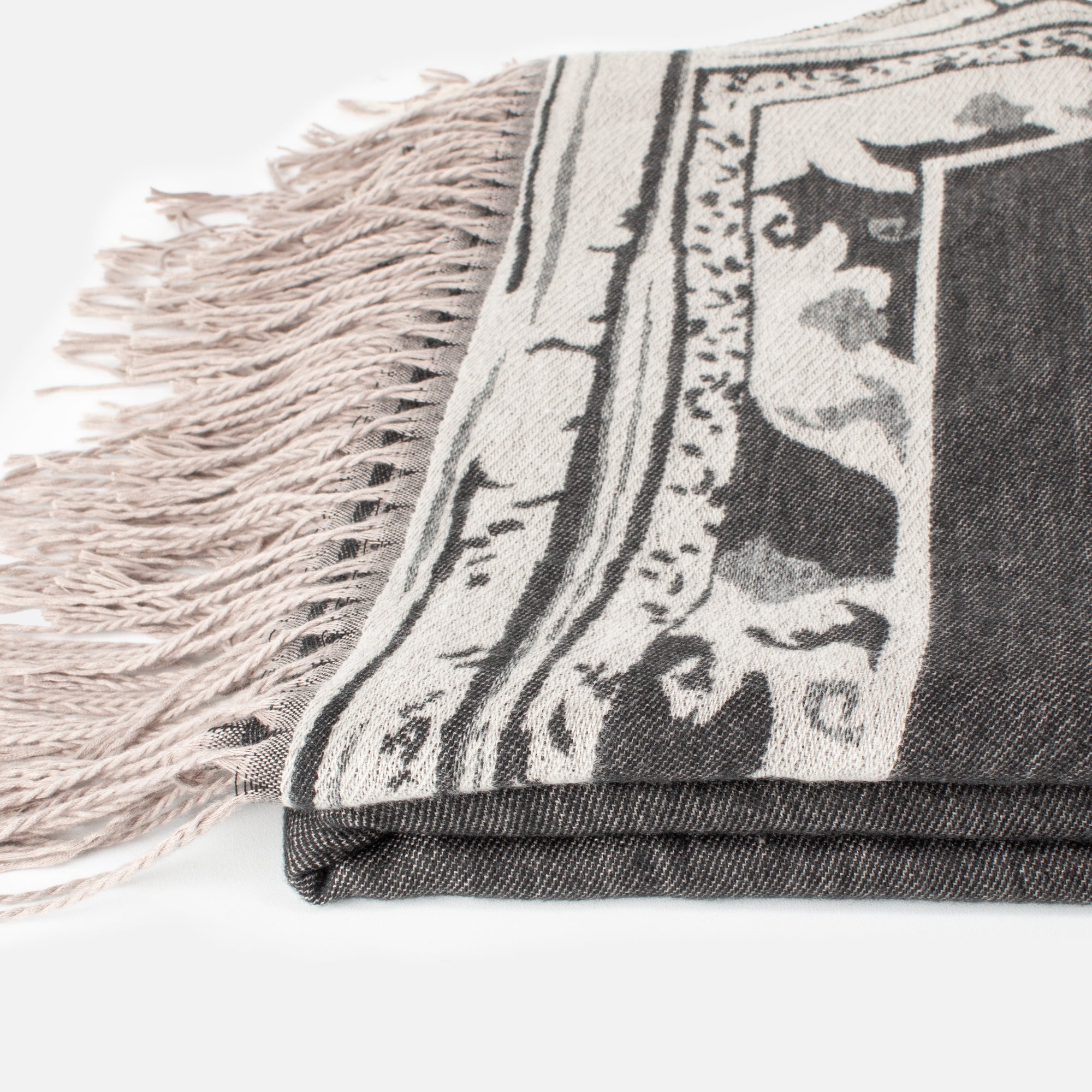 Dark gray poncho with pattern and fringe