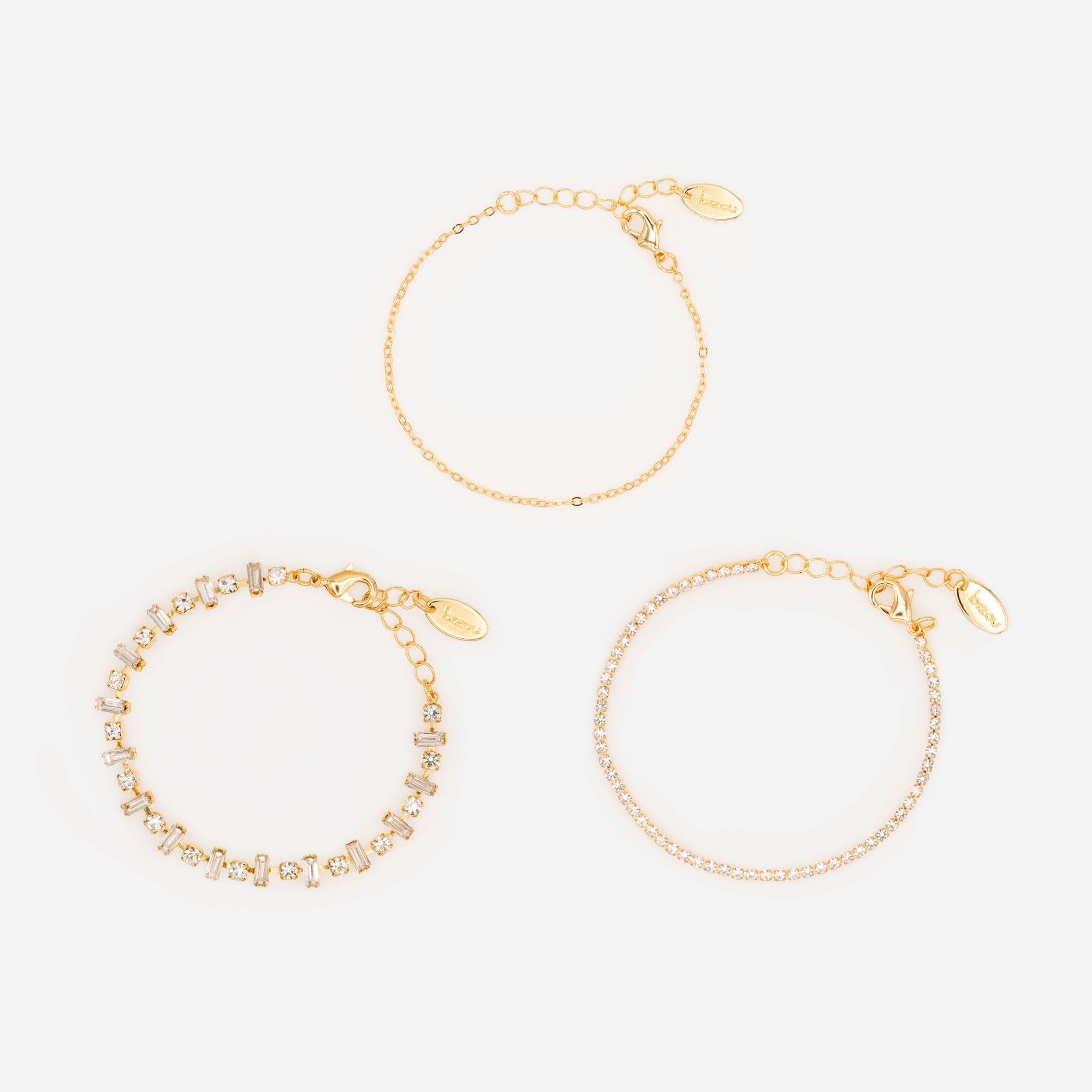 Ensemble de trois bracelets dorés avec pierres