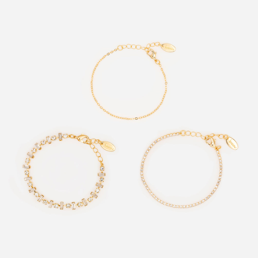 Set of three gold bracelets with stones