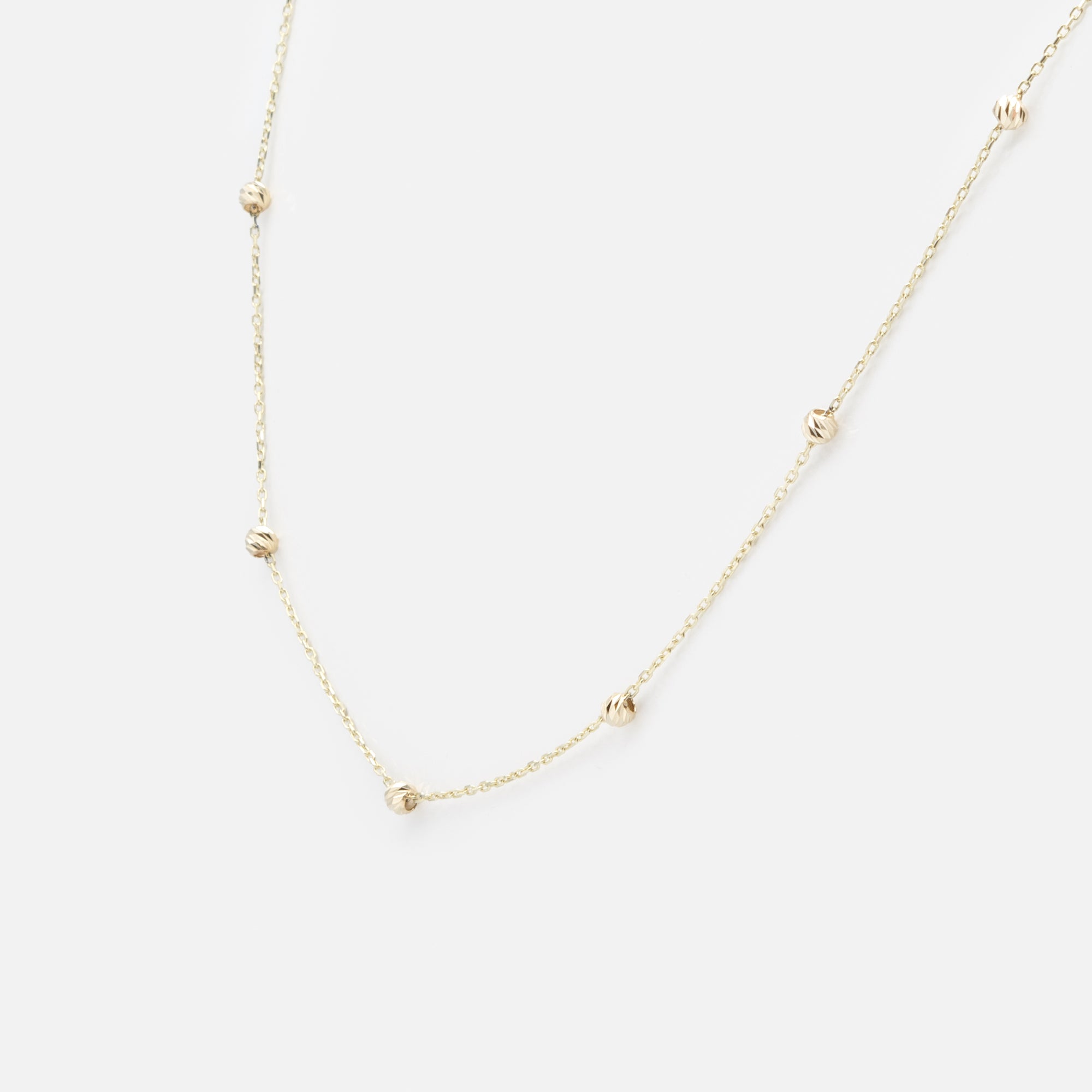 18-inch chain with small textured beads in 10-karat gold