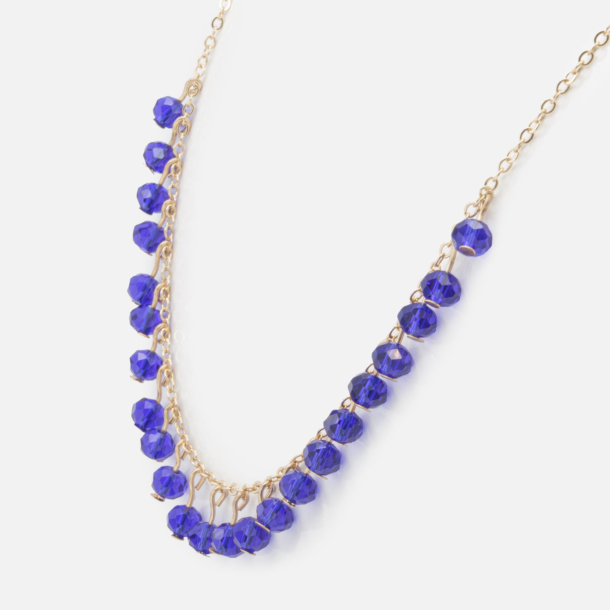 Royal blue ball necklace and gold triangle earrings set with mother-of-pearl and cubic zirconia