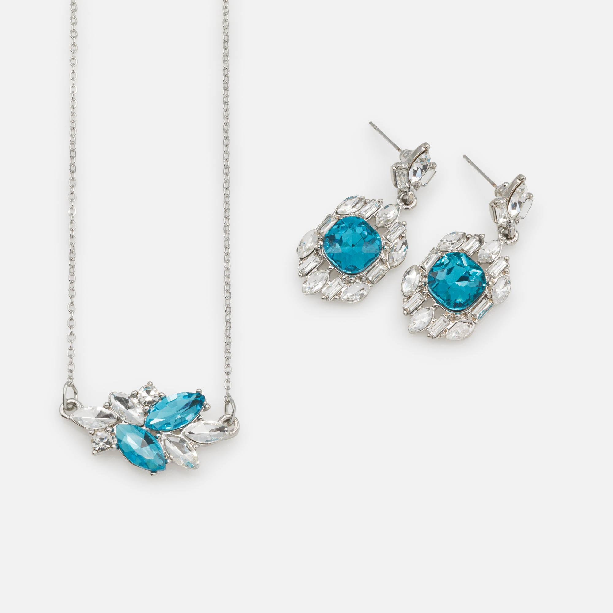 Silver necklace and dangling earrings set with white and turquoise stones