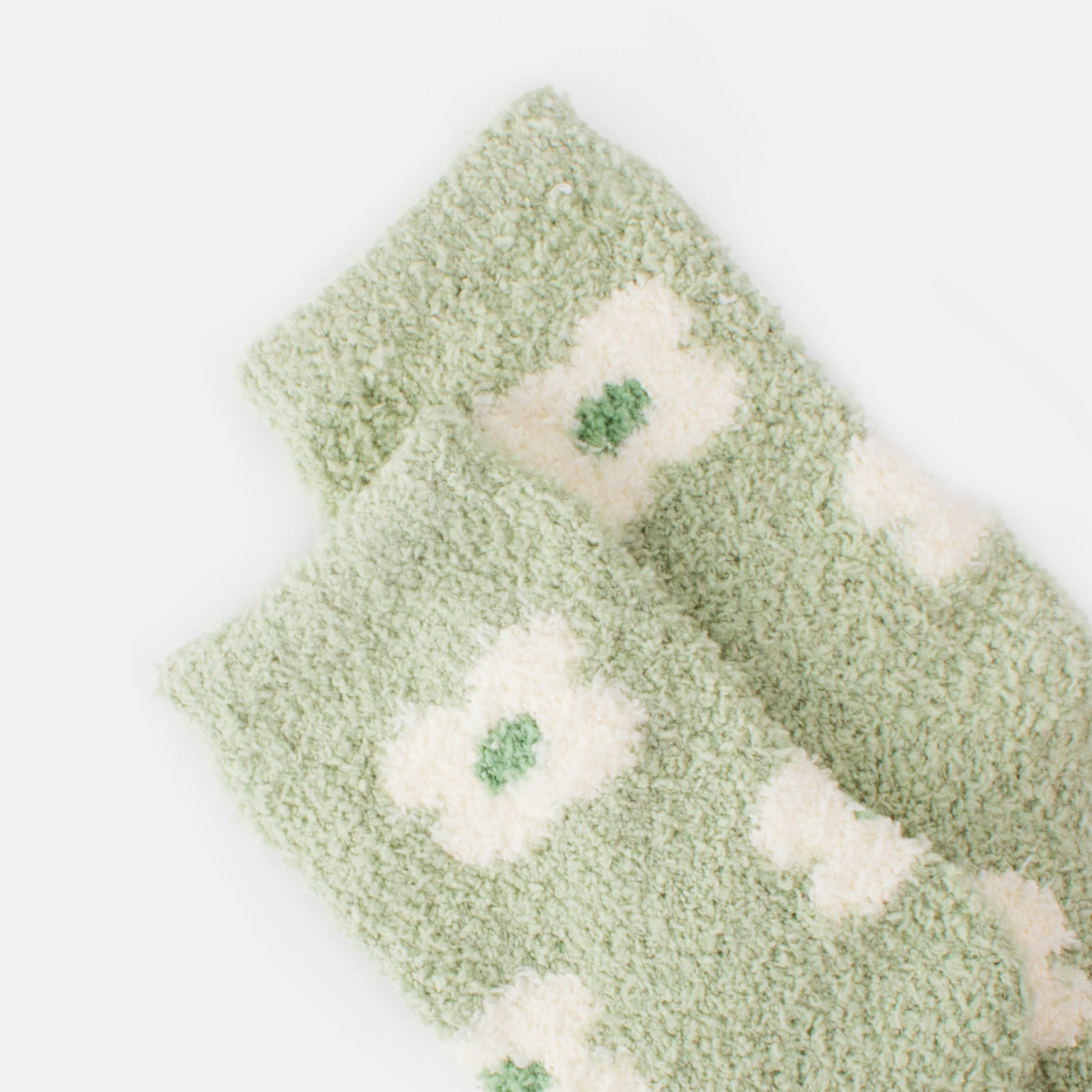 Cozy pale green stockings with white flowers