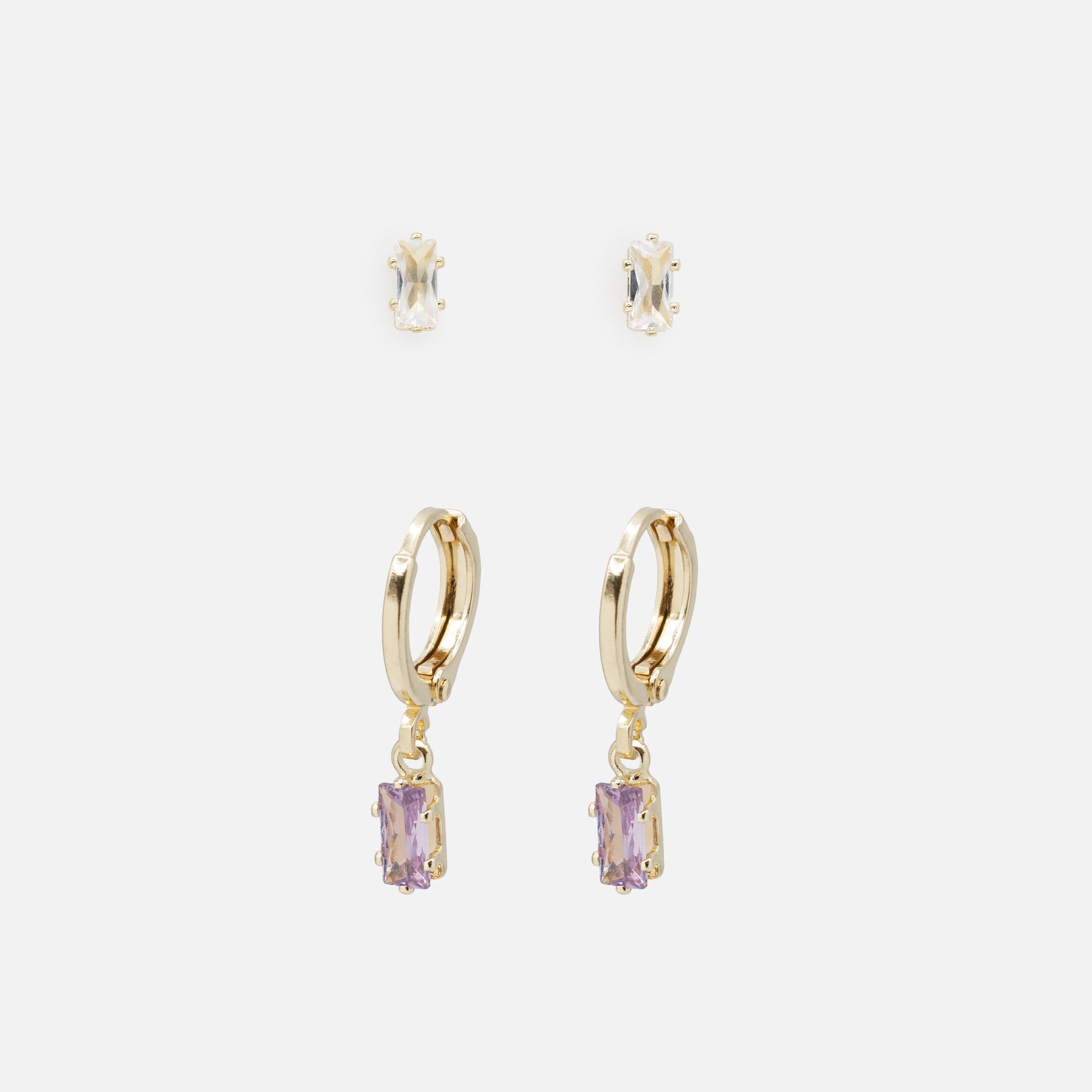 Duo of golden earrings with white stone and rings with purple stone charm