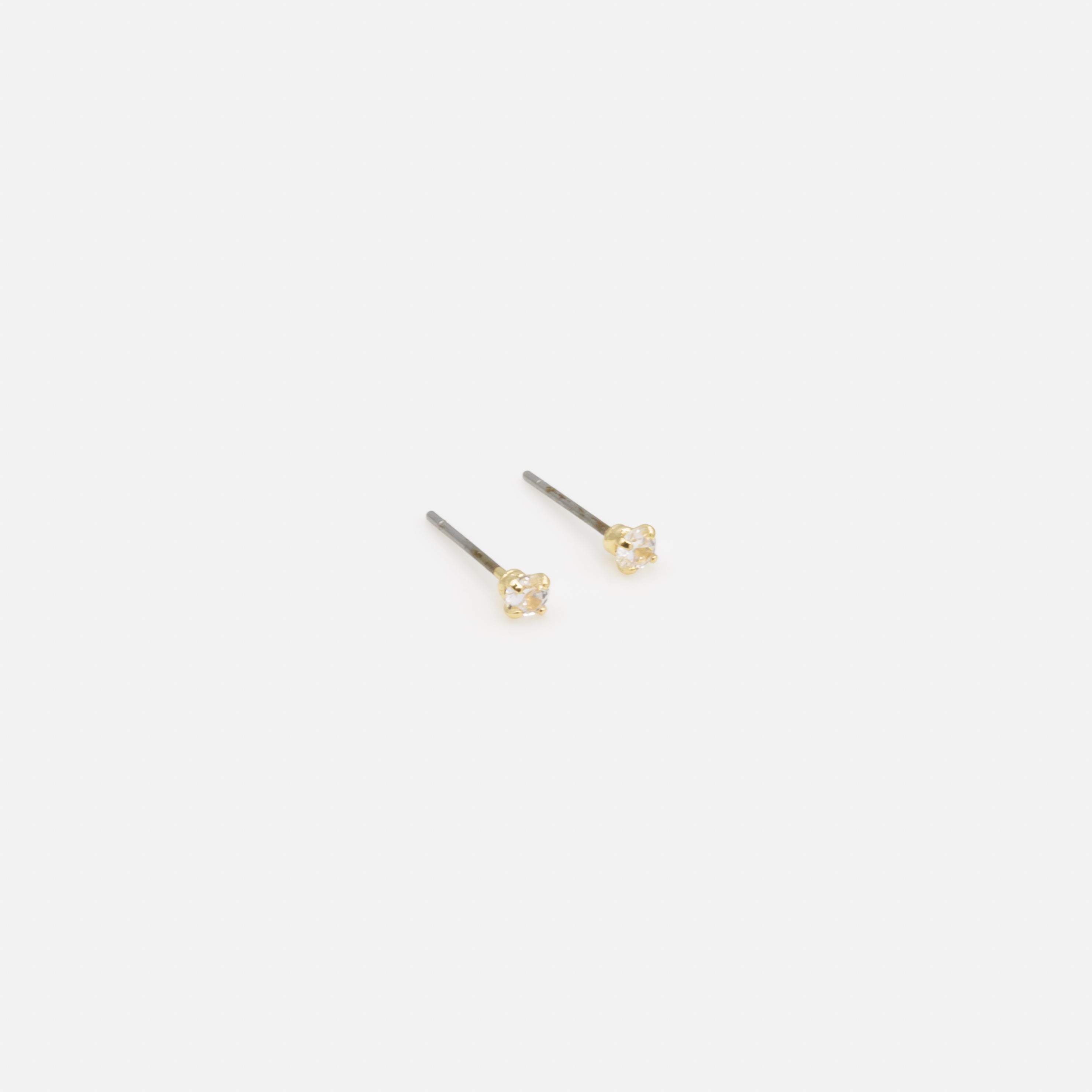 Trio de boucles d'oreilles fixes dorées avec zircons cubiques