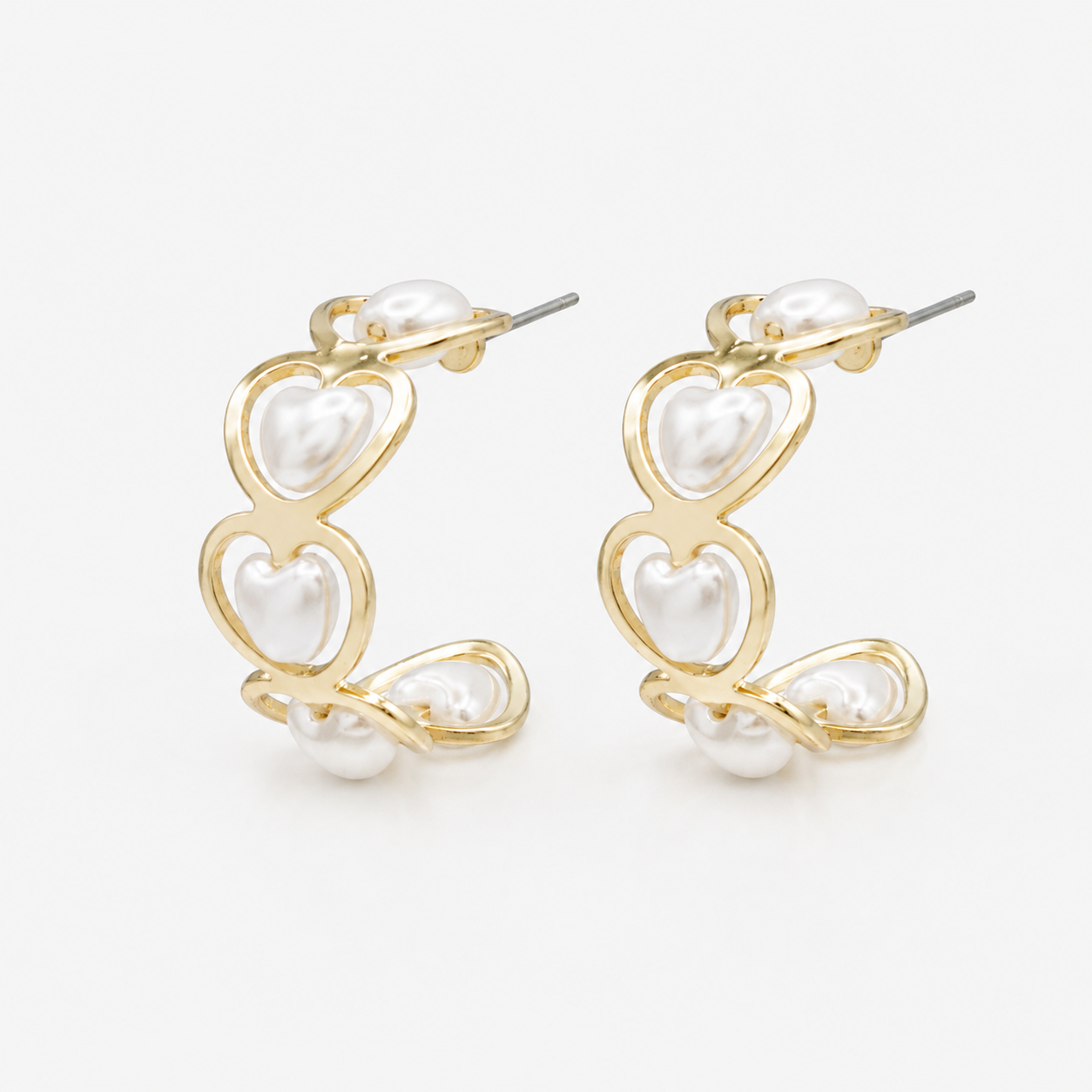 Gold half-circle earrings with heart-shaped pearls