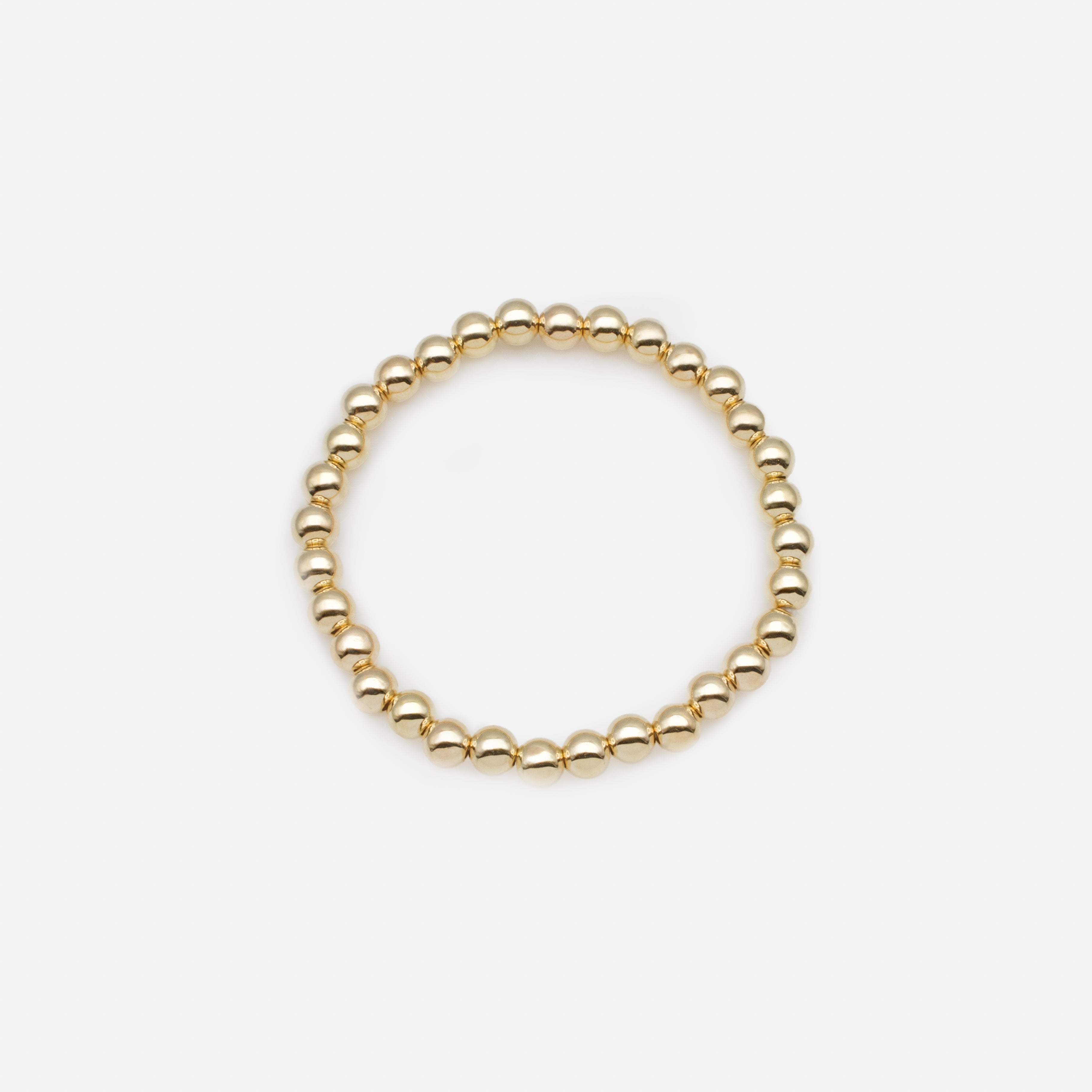 Trio de bracelets élastiques avec billes noires et dorées