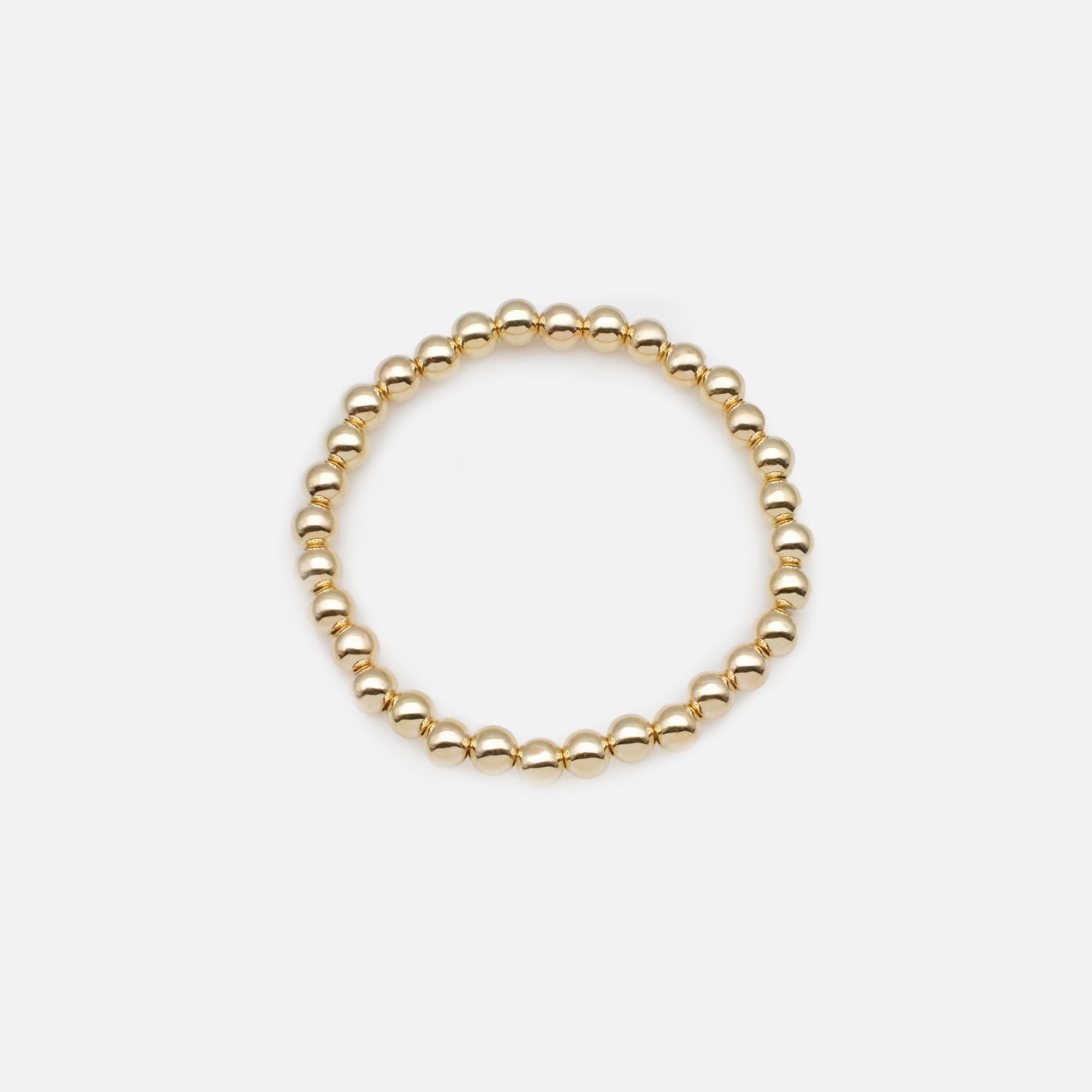 Trio de bracelets élastiques avec billes noires et dorées