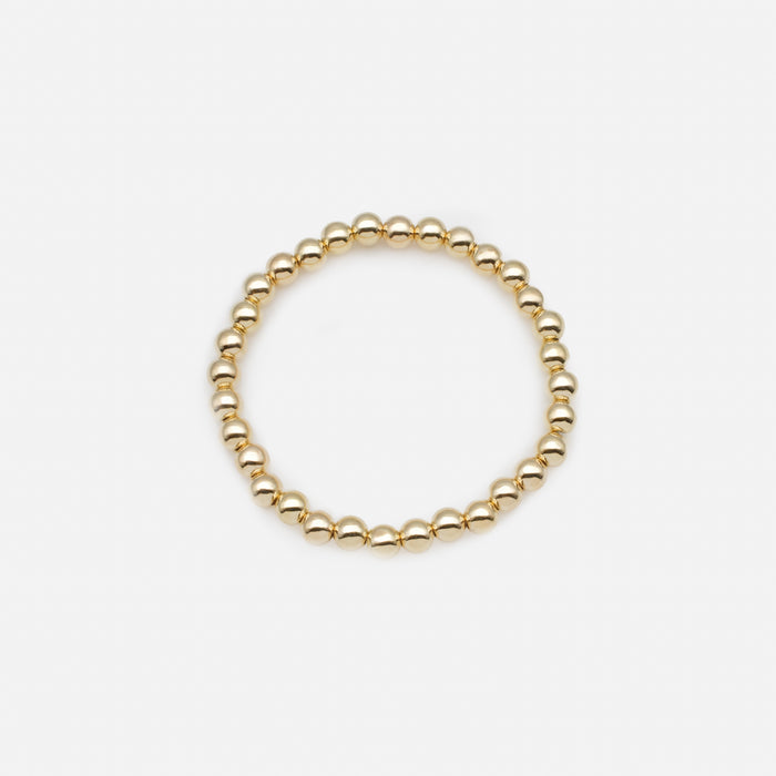 Trio de bracelets élastiques avec billes noires et dorées