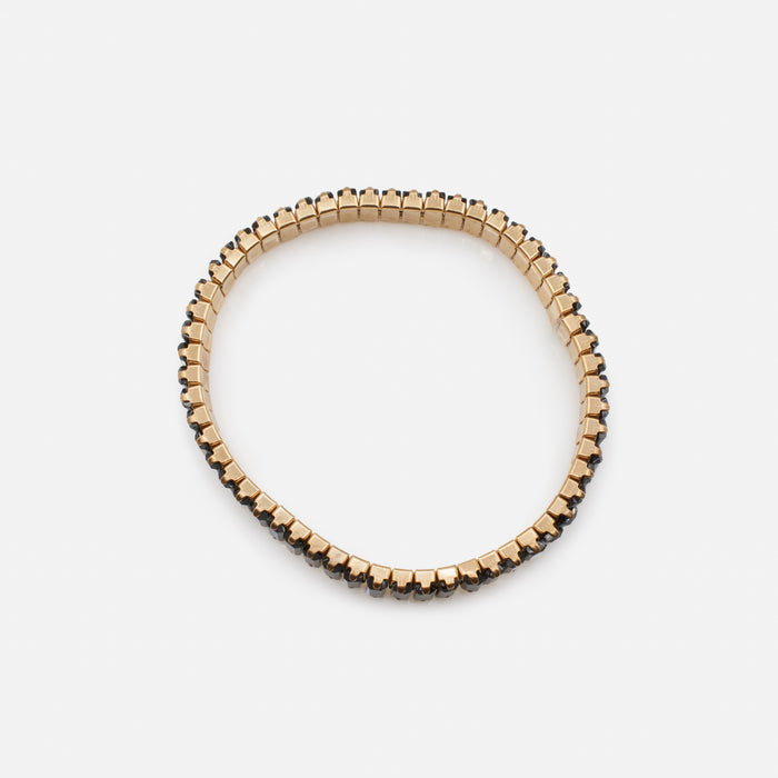 Bracelet élastique doré avec pierres rectangulaires noires