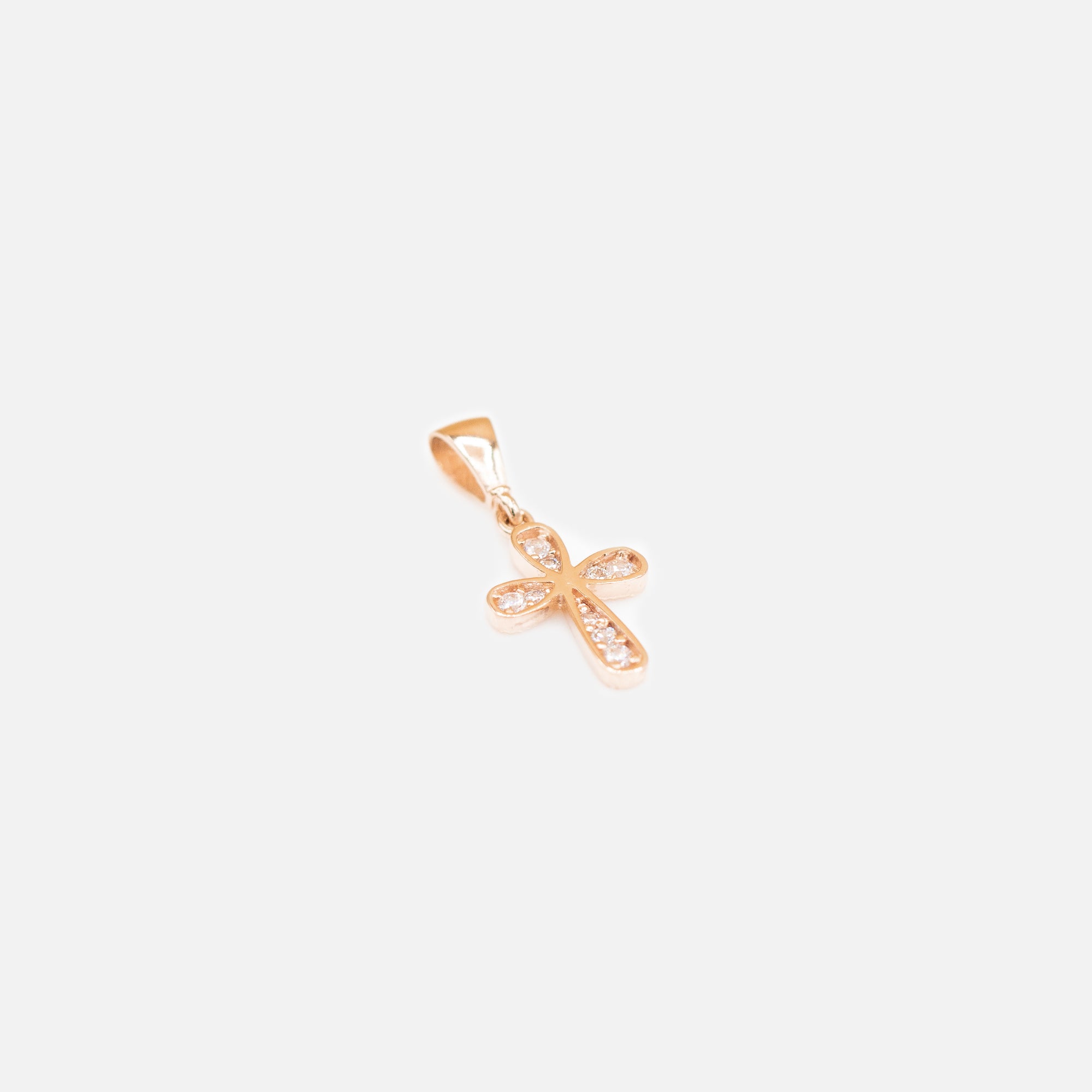 Rose gold cross charm in 10k yellow gold