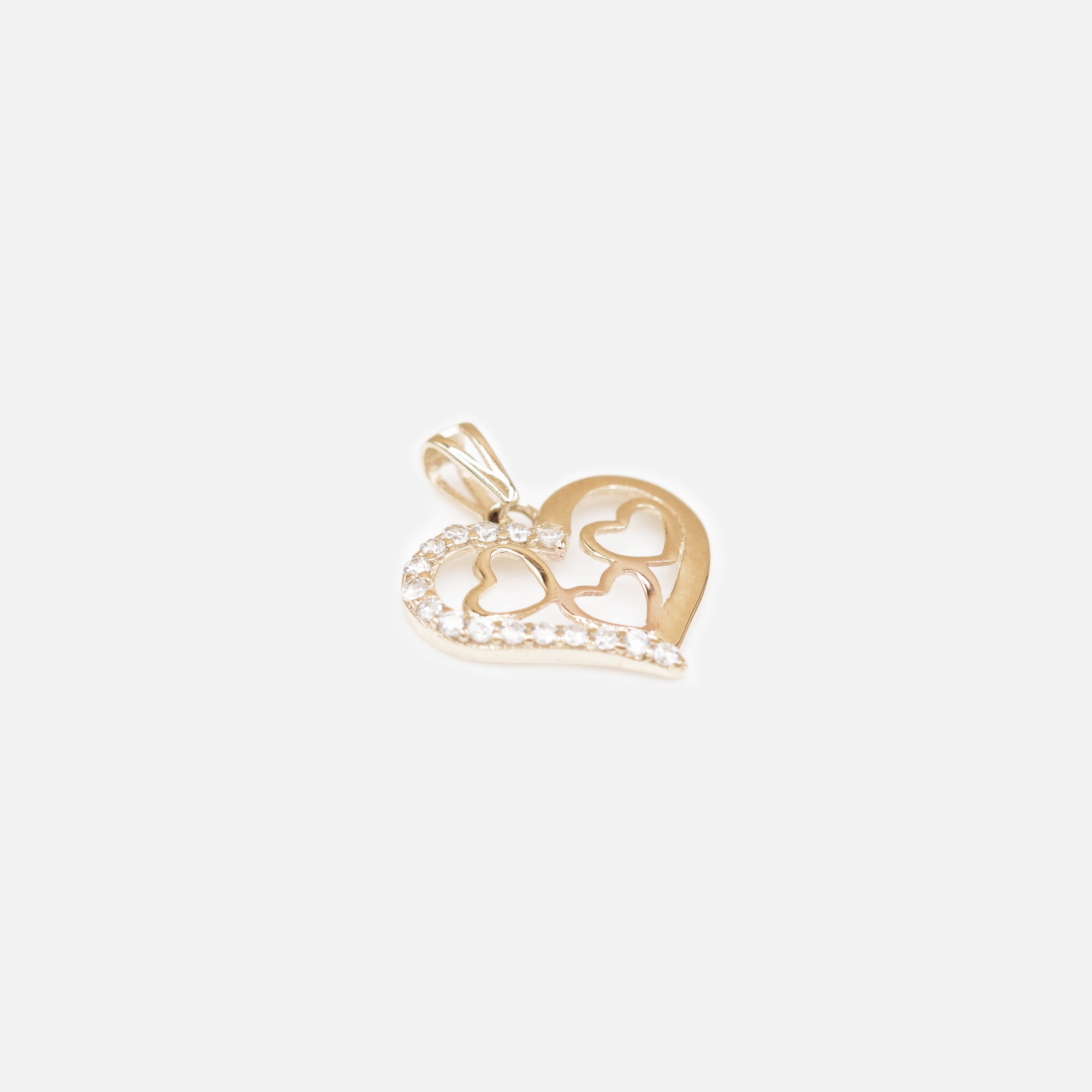 Large heart charm with three small hearts in 10k gold 