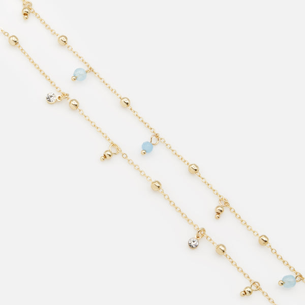 Load image into Gallery viewer, Pair of gold ankle chains with blue beads
