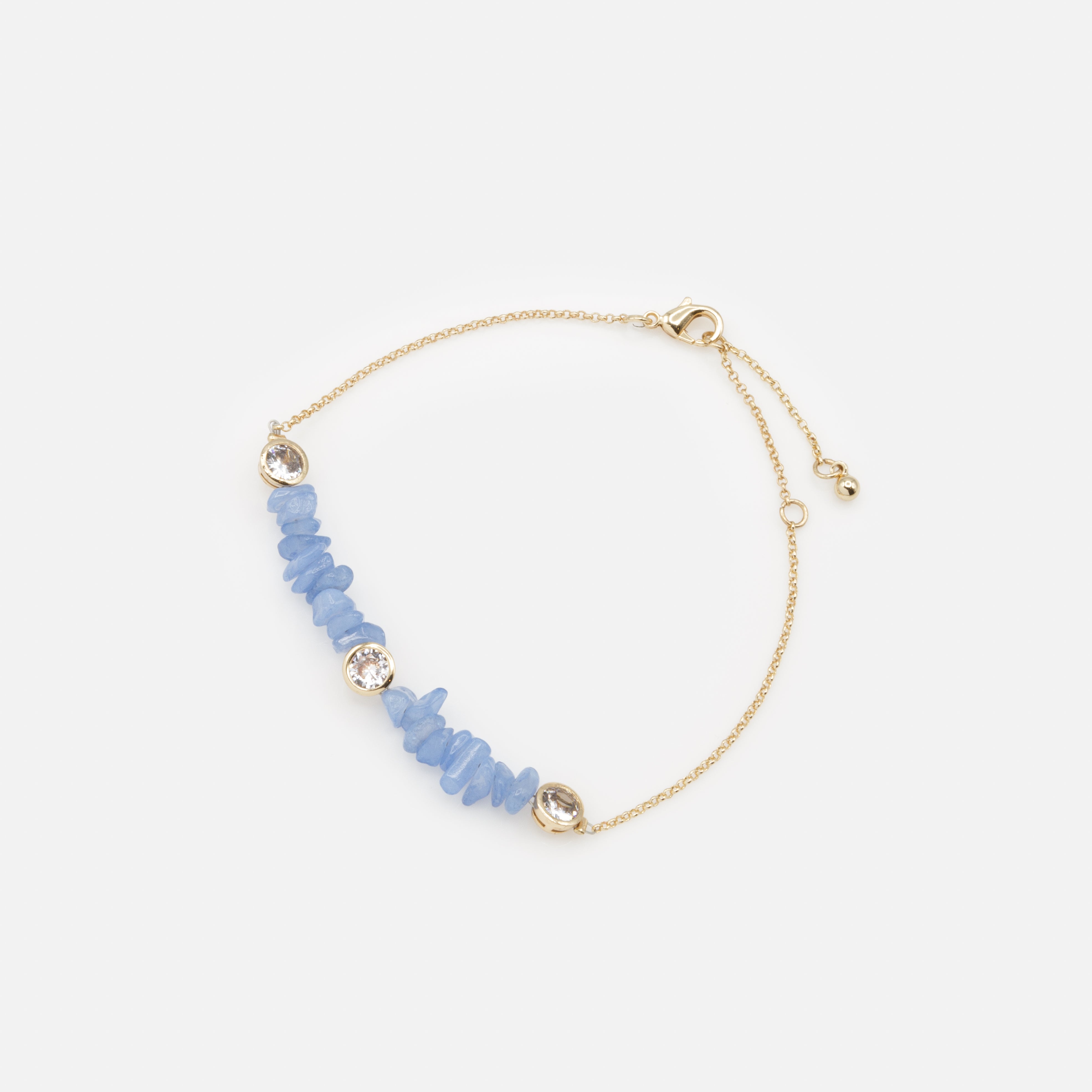 Gold bracelet with small blue stones