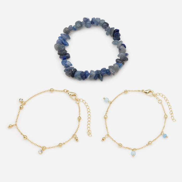 Trio of gold bracelets with blue stones and beads