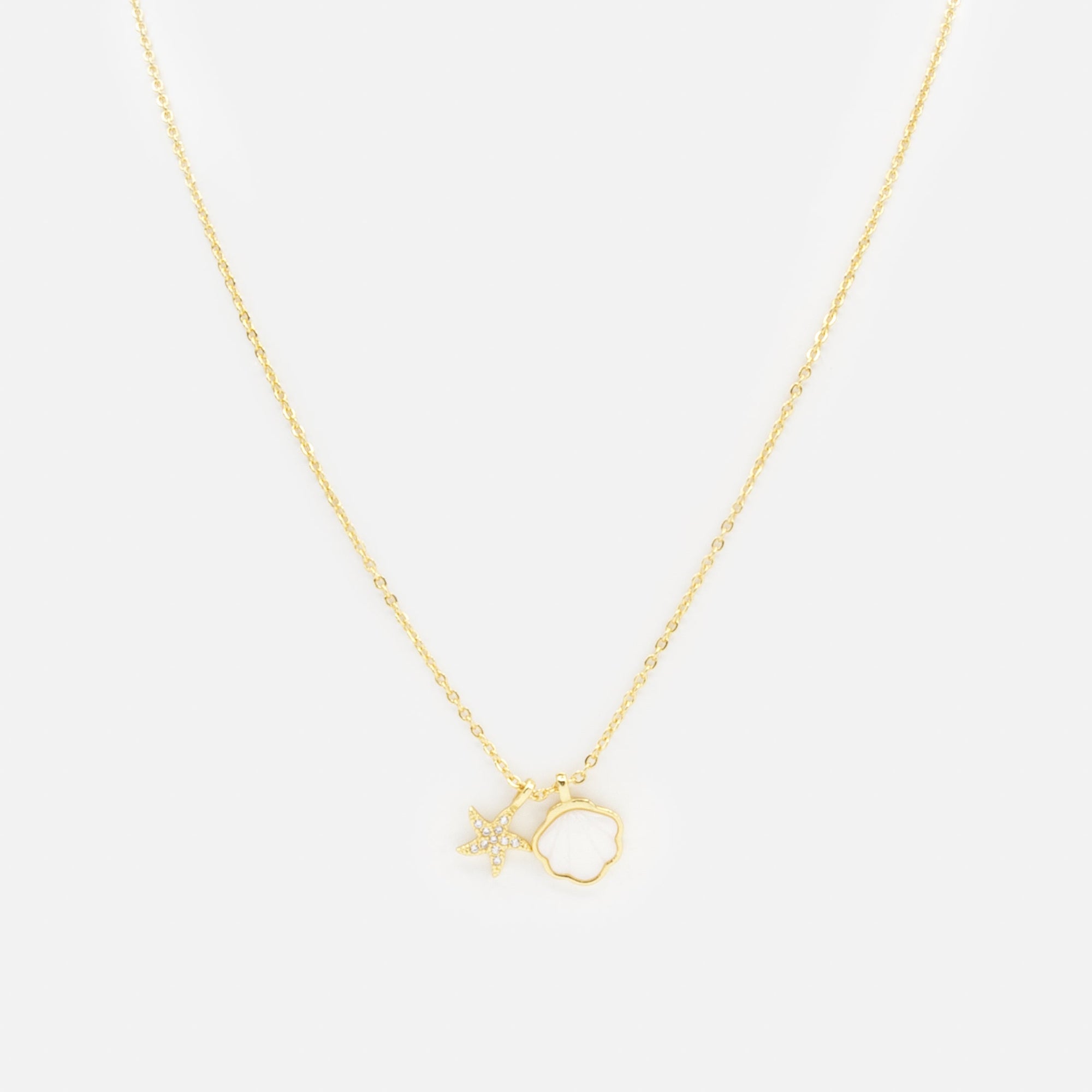 Gold necklace with shell and starfish charms