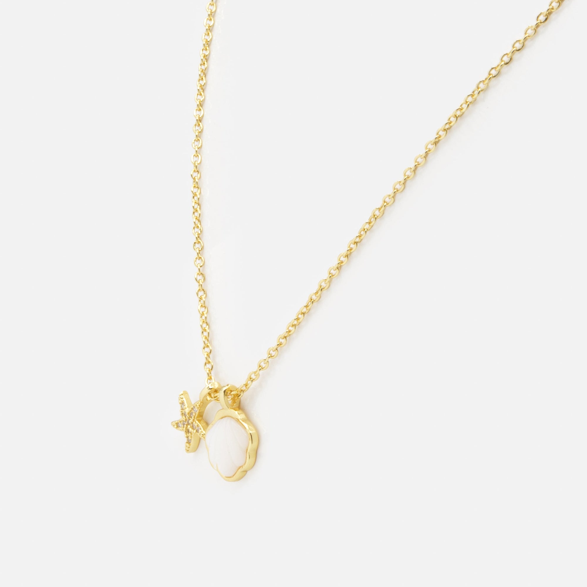 Gold necklace with shell and starfish charms