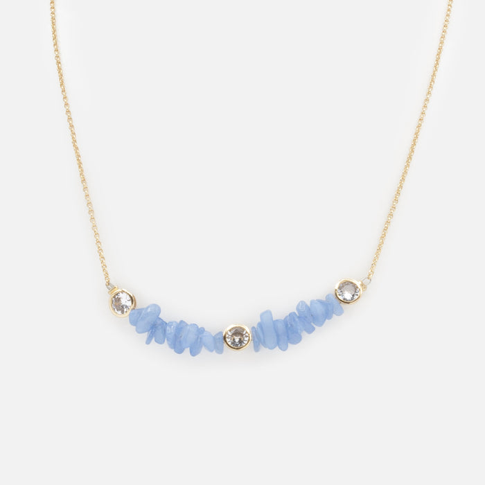 Gold necklace with small blue stones