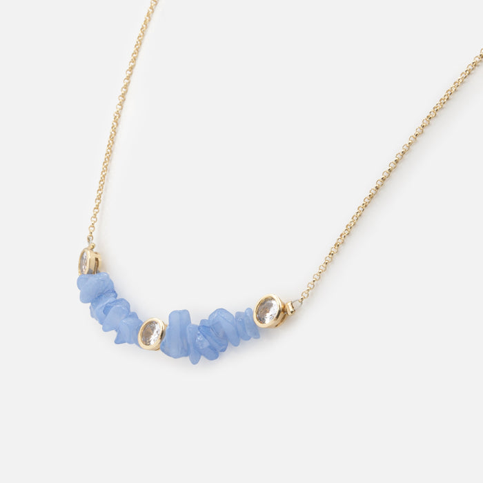 Gold necklace with small blue stones