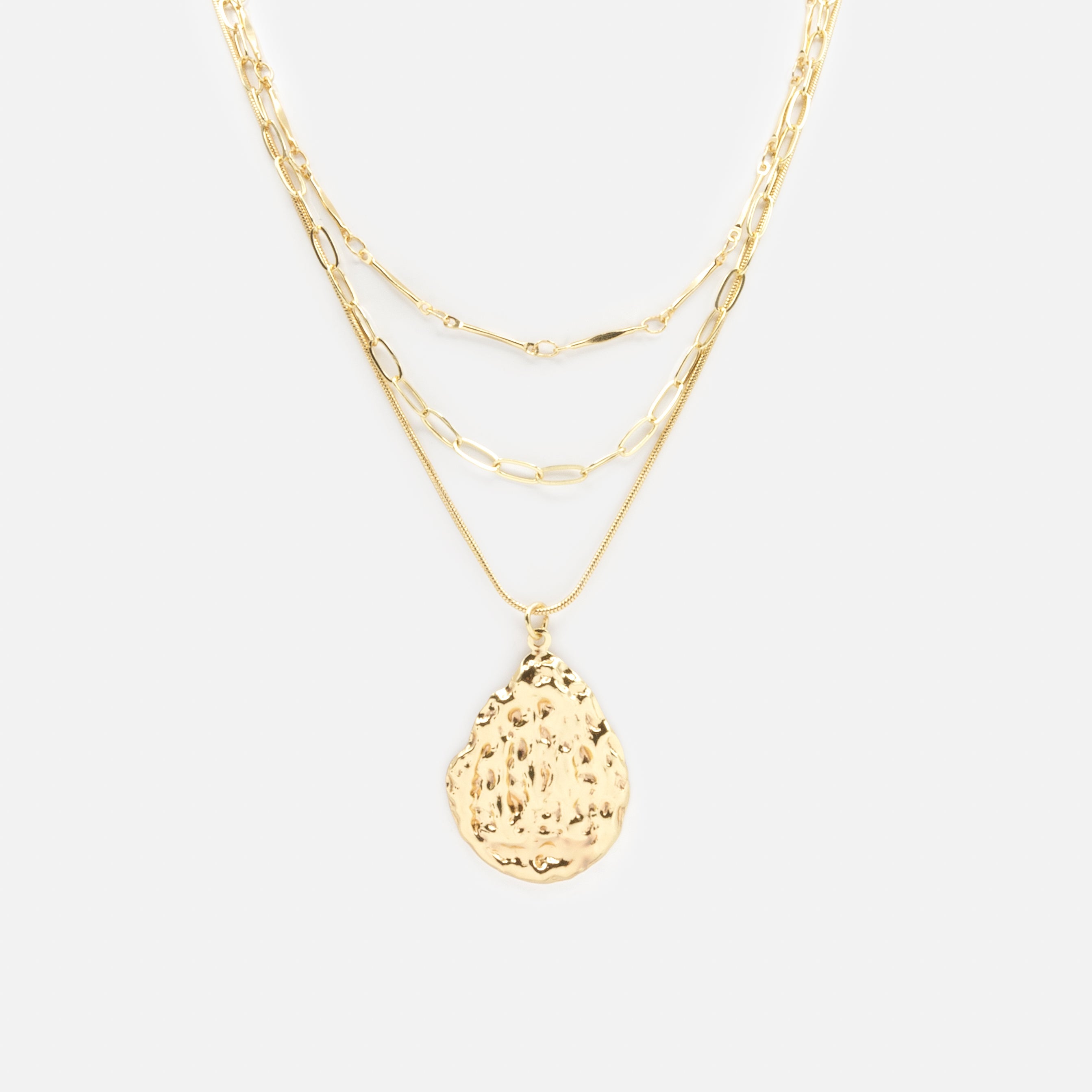 Gold triple chain necklace with textured charm