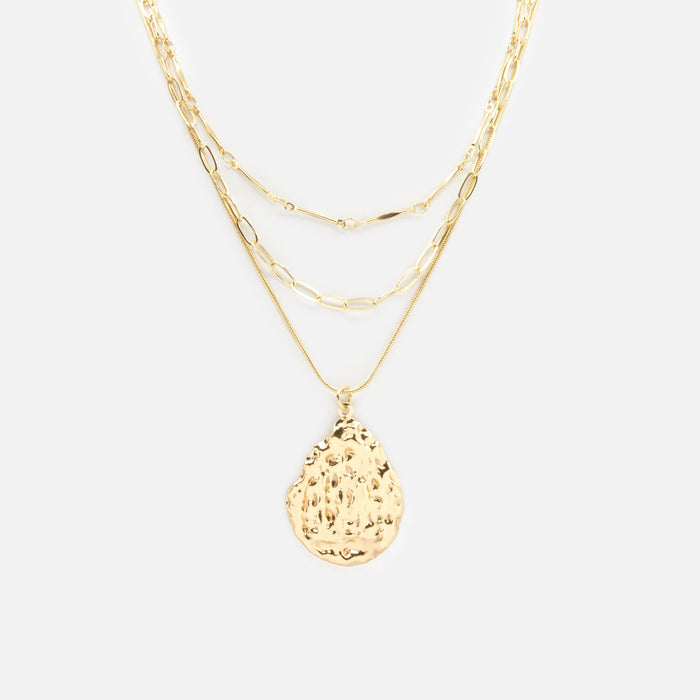Gold triple chain necklace with textured charm