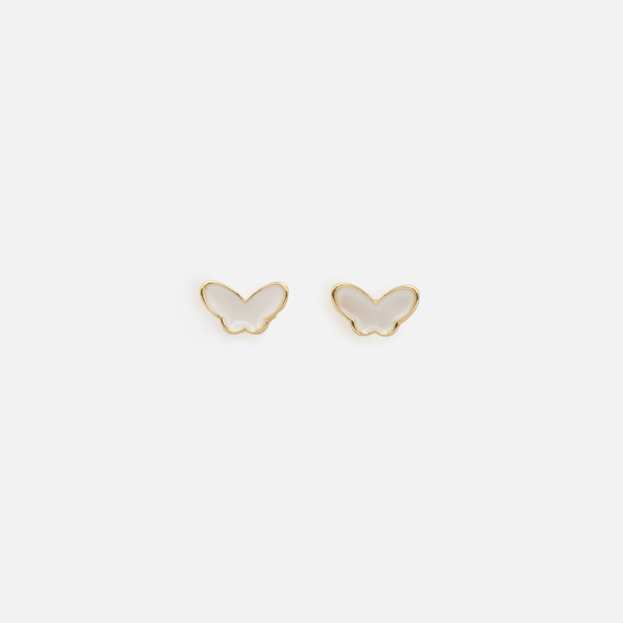 Trio of white butterfly earrings and gold rings
