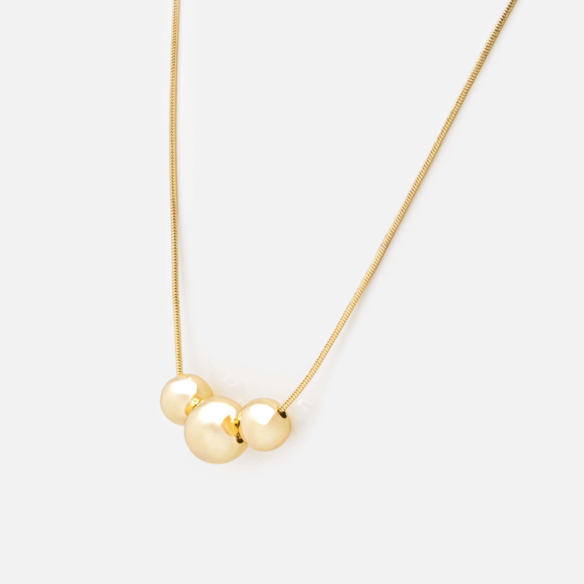 Golden sphere trio necklace