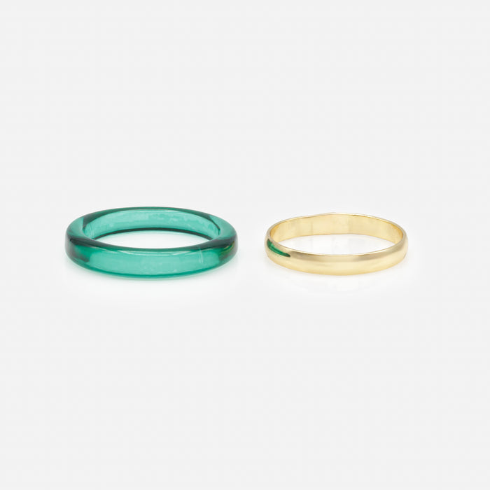 Duo of gold and emerald rings