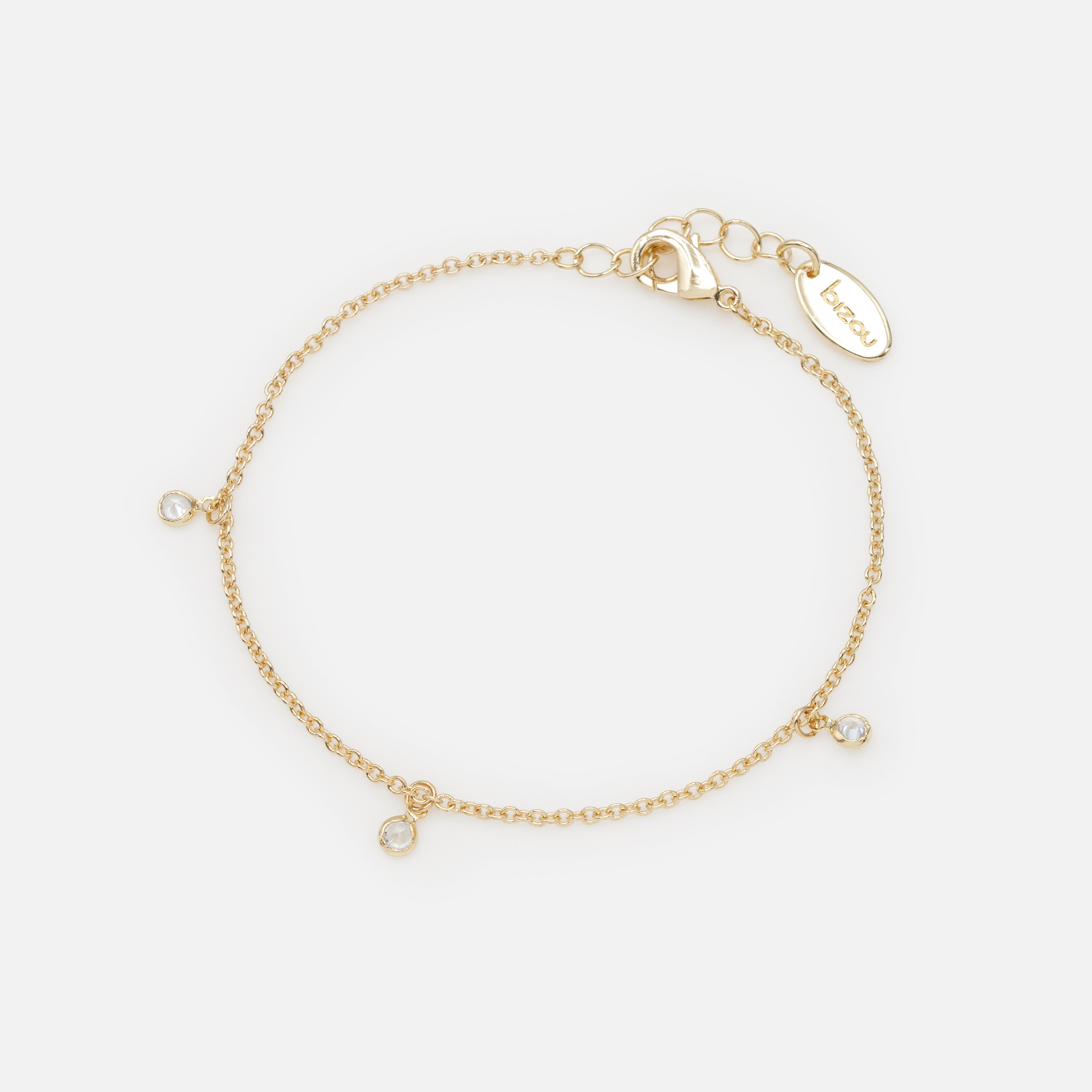 Gold bracelet with small round charms and cubic zirconia