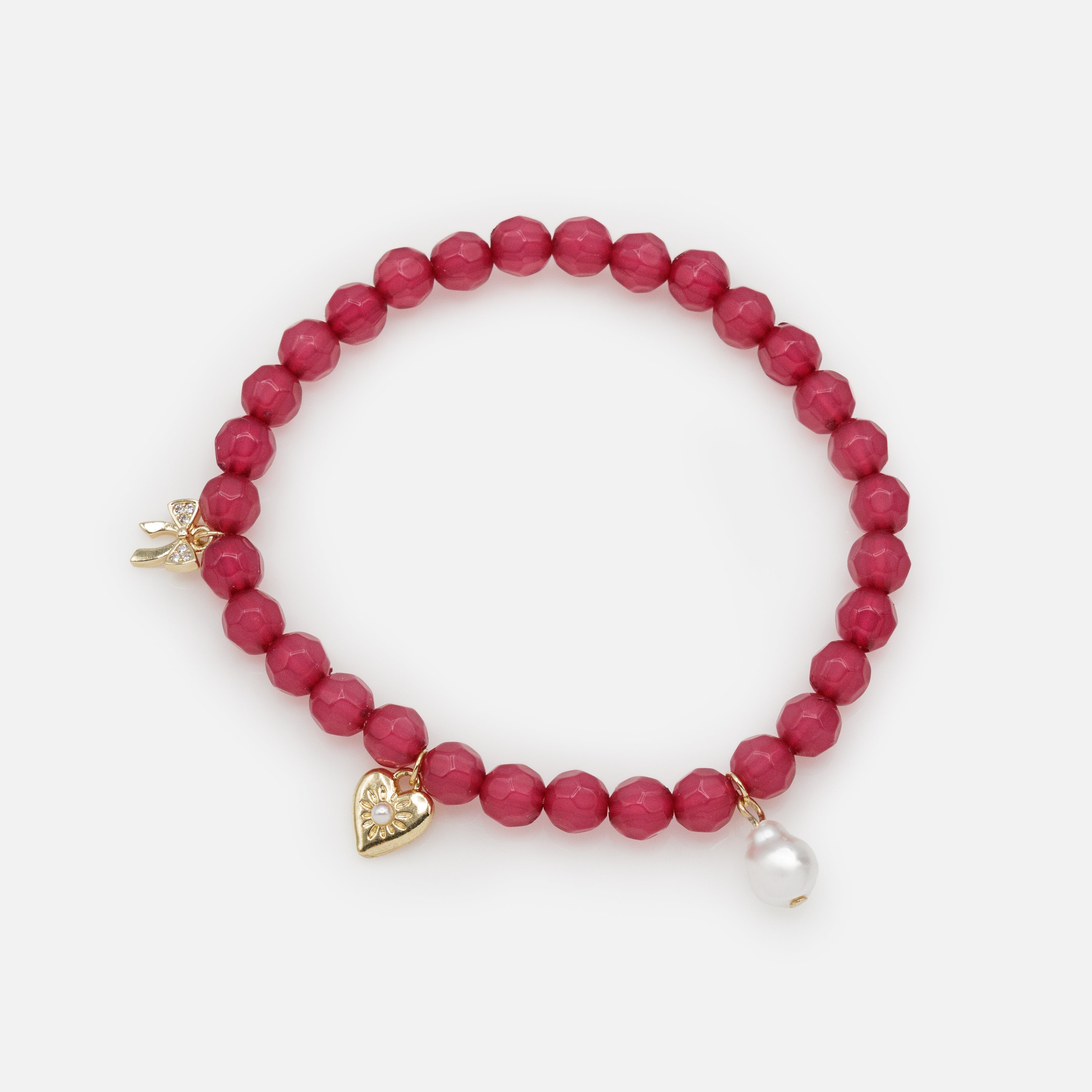 Dark pink elastic beaded bracelet with trio of charms