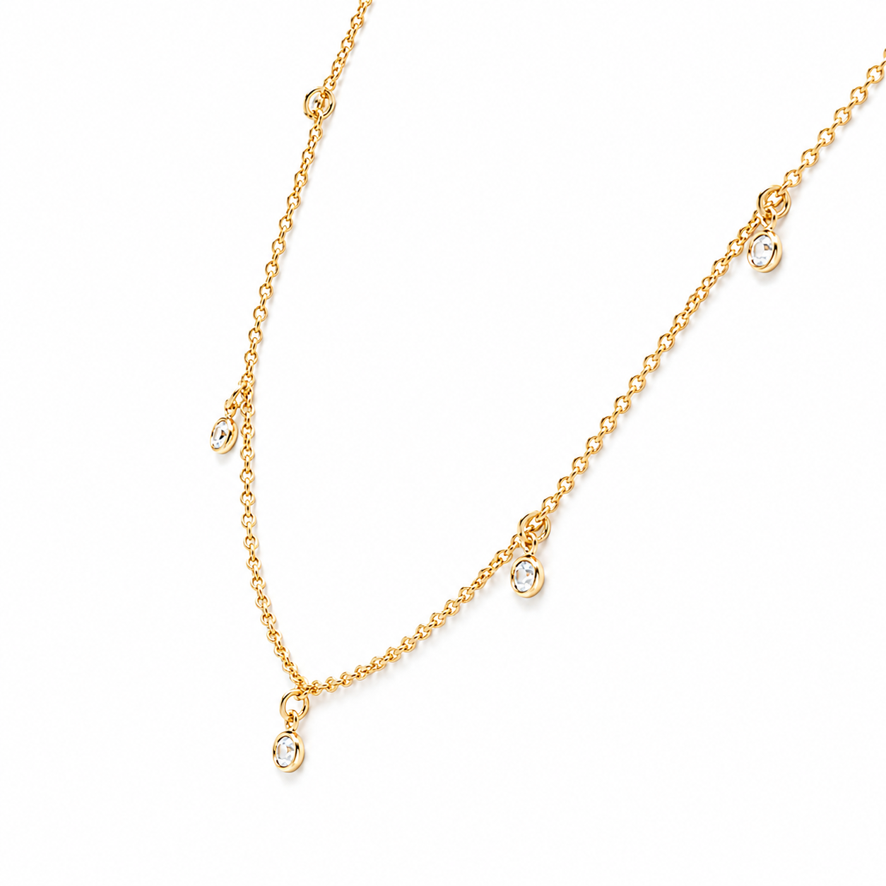 Gold necklace with small round charms and cubic zirconia