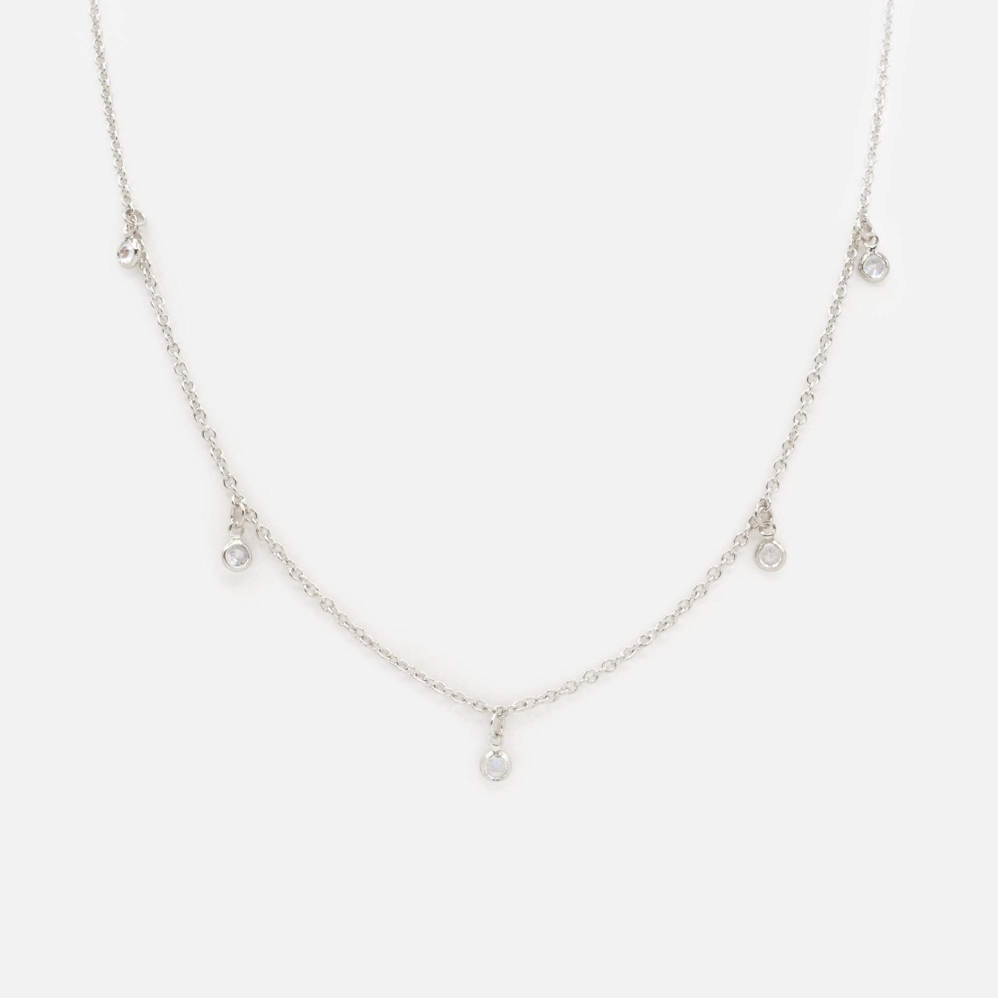 Silver necklace with small round charms and cubic zirconia
