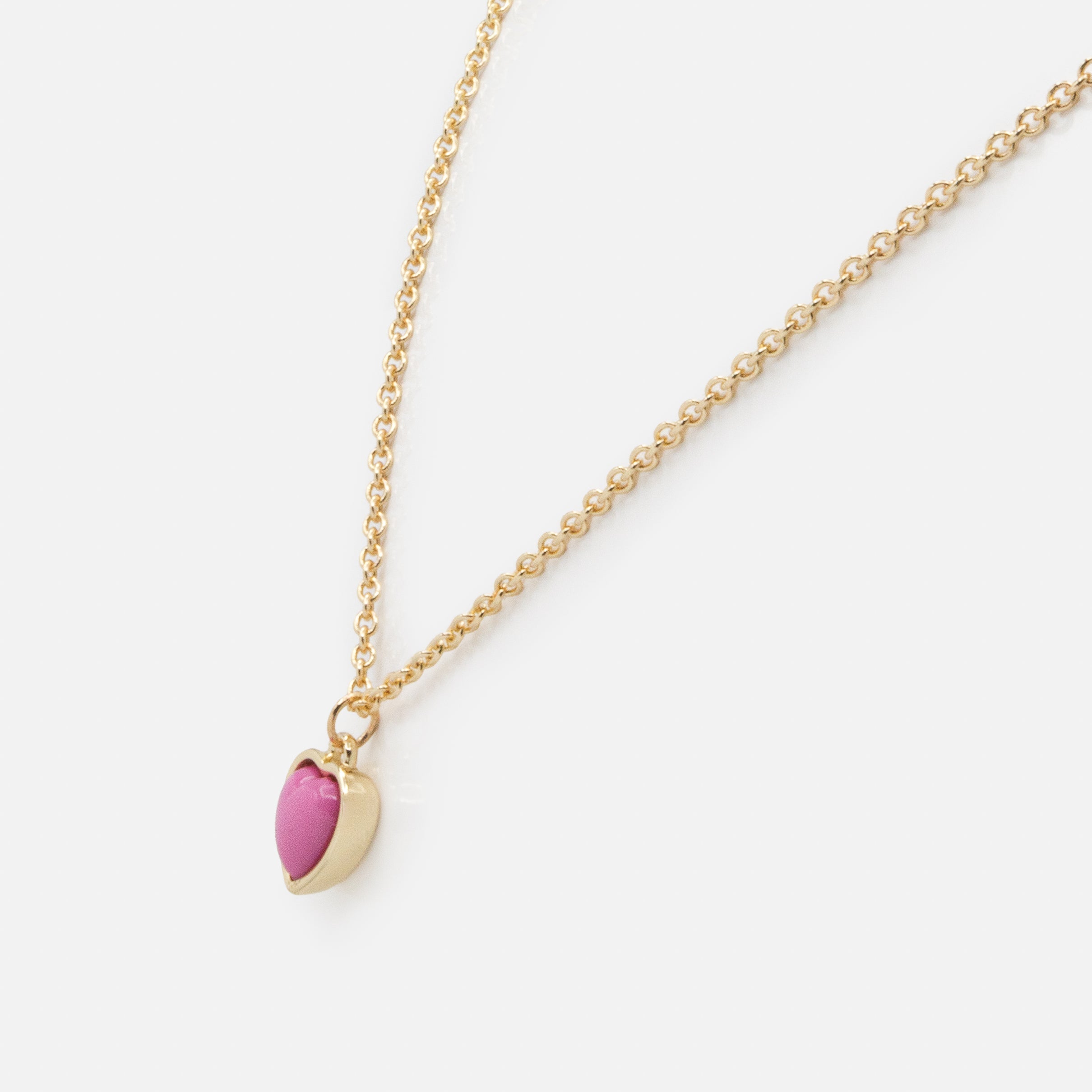 Collier doré breloque cœur rose