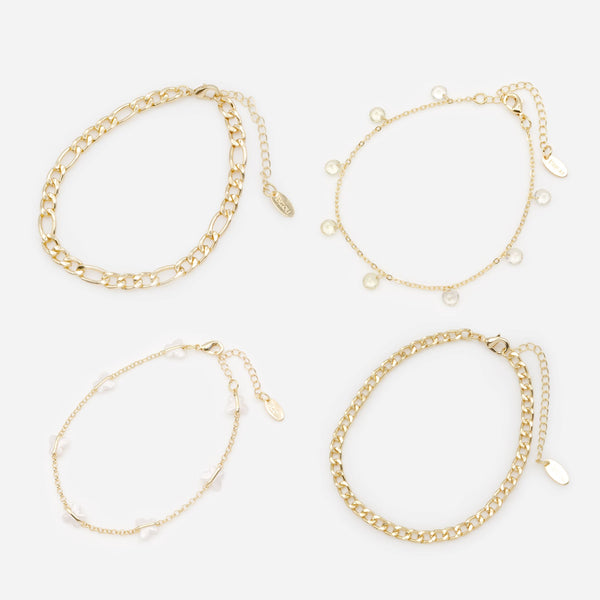 Load image into Gallery viewer, Set of four gold anklets with white butterflies

