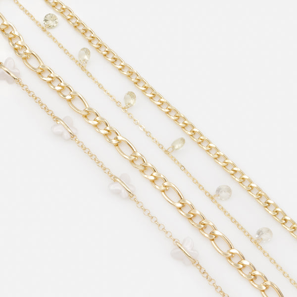 Load image into Gallery viewer, Set of four gold anklets with white butterflies
